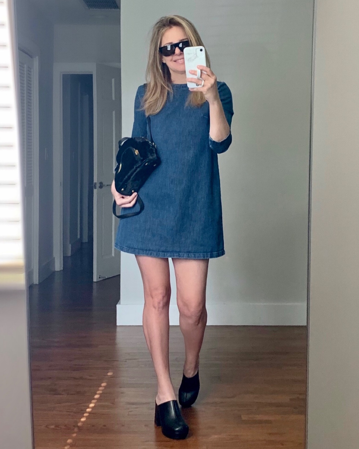 Denim a-line short dress with black leather clogs. I like how the leather wraps around the heels of these so there’s no contrast with a wooden sole, just all black leather

#LTKSeasonal #LTKShoeCrush #LTKStyleTip