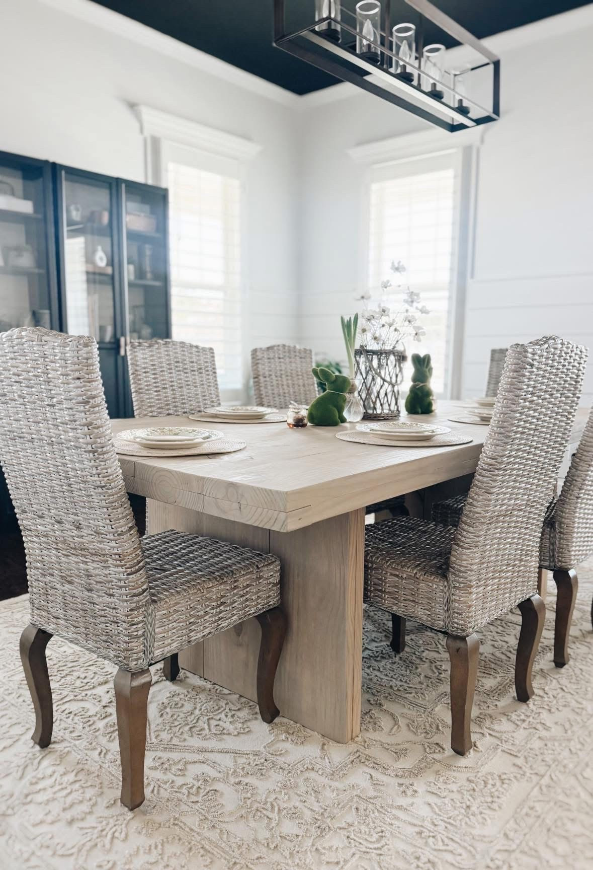 Neutral dining room with woven chairs, a chunky modern wood table, and soft Easter touches like moss bunnies makes the perfect springtime setup! #LTKhome #diningroomdecor #springtabledecor #neutralhome

#LTKHome #LTKSeasonal