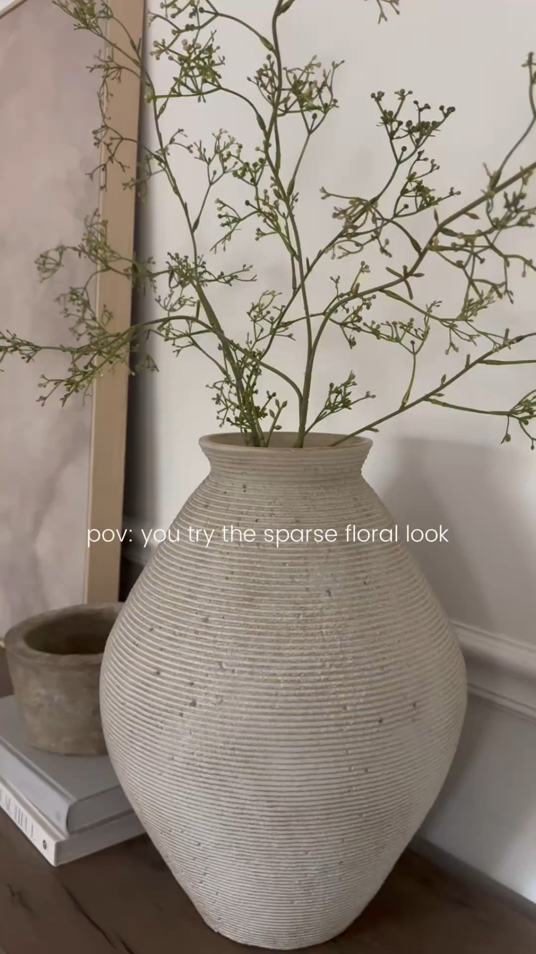 The prettiest stems! Less than $6 for three. I used two stems in the vase on the brown console table. I used one stem in each case on my arched bookcase shelves.

#LTKHome