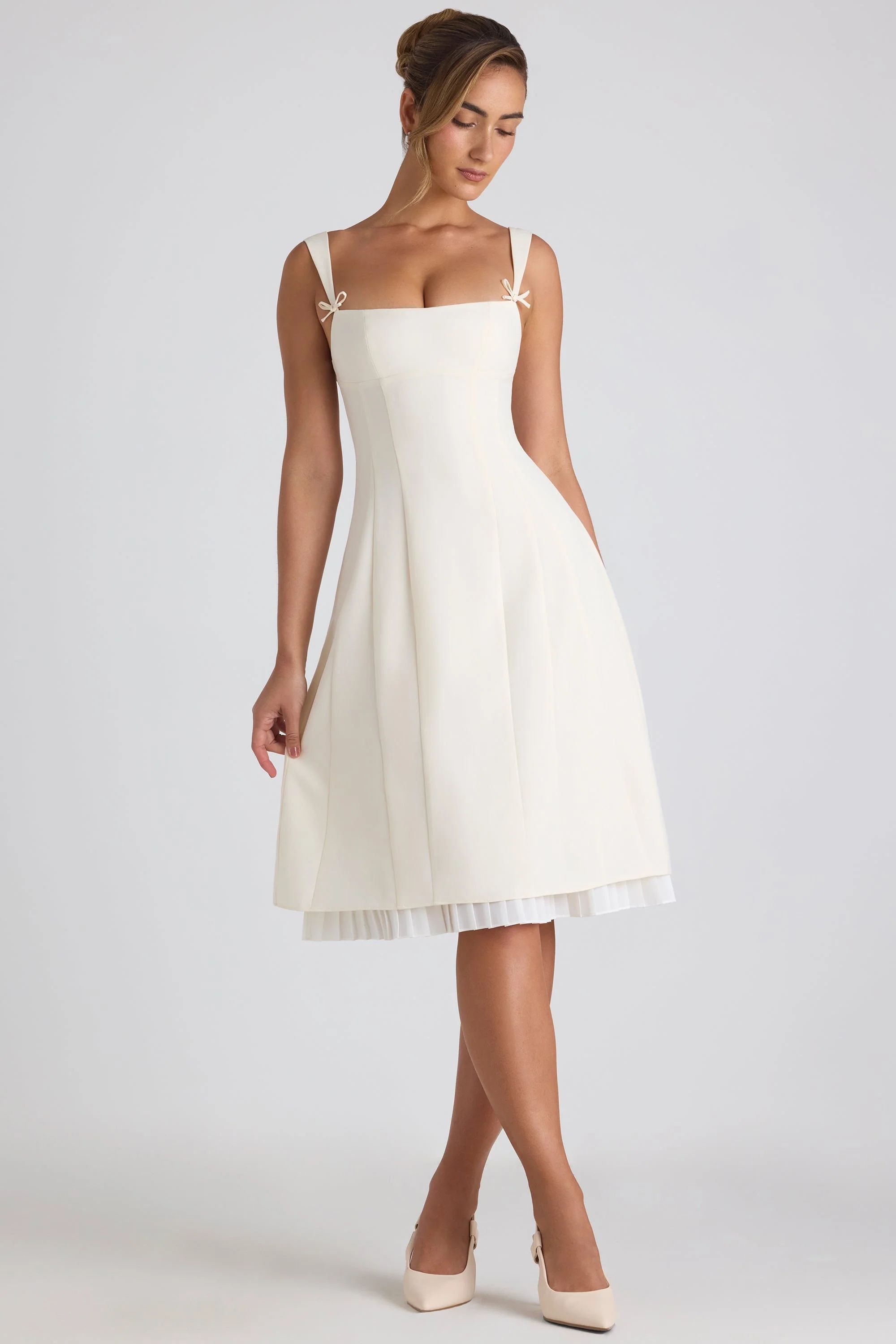 Bow-Embellished Pleated A-Line Midi Dress in Ivory | Oh Polly