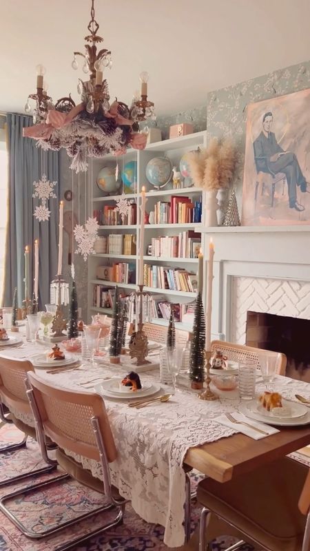 How to create a Narnia inspired tablescape: hang a flocked wreath and snowflakes from the chandelier, and add woodland animals as place cards and lots of whites and golds!

#LTKhome #LTKHoliday #LTKSeasonal