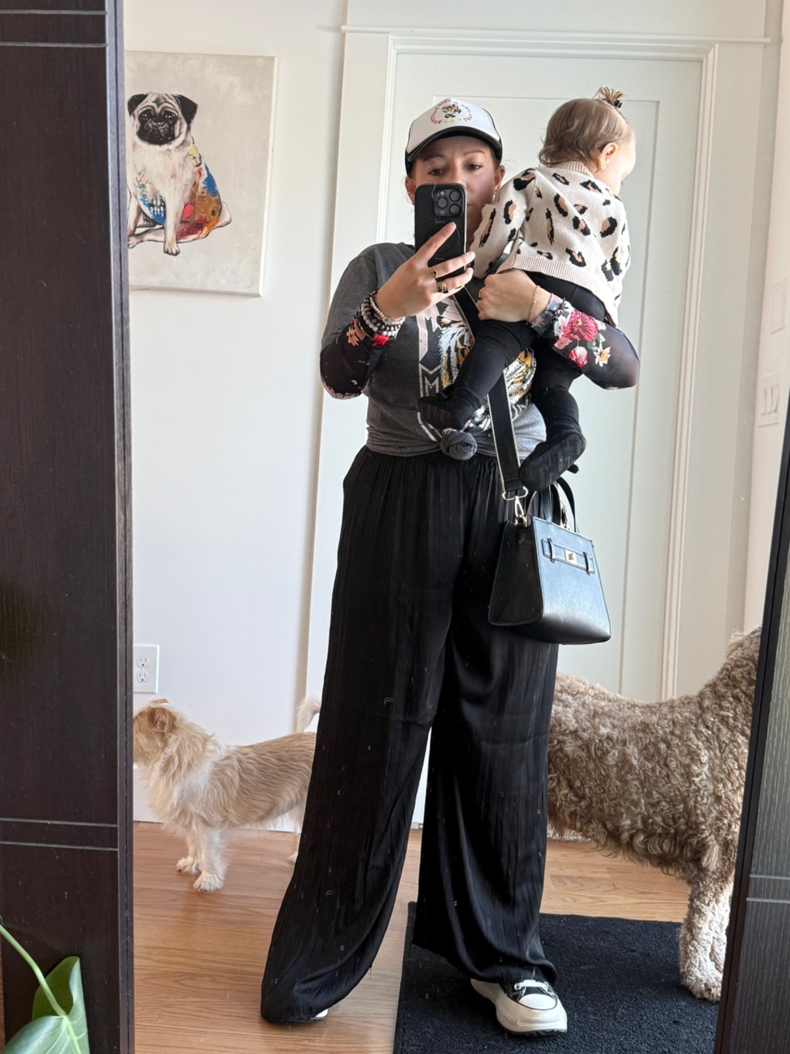 Easy mom streetwear outfit for real-life days. 
Comfy wide-leg pants, sneakers, a graphic top, and a hat. Cute, practical, and baby-carrying approved.

#LTKootd #LTKmomlife #LTKdayinmylife