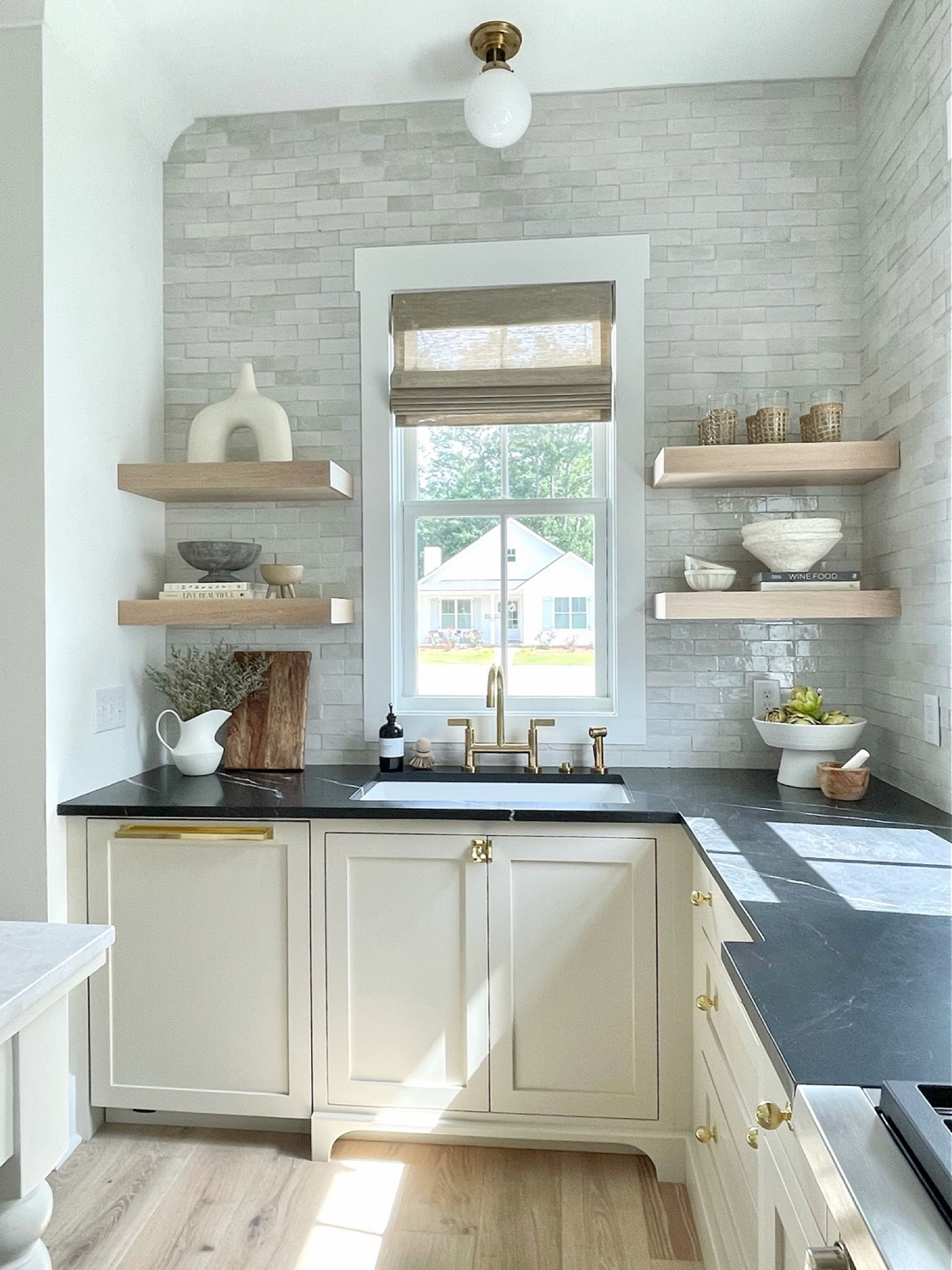 Kitchen decor.  Kitchen counter decor.  kitchen island decor. Cutting boards.  Salt & pepper mills.  Kitchen lighting.  Kitchen cabinet hardware.  White oak shelves.  Brass bridge faucet.  Shelf decor.  Kitchen sink.  Modern farmhouse sink.

#LTKunder50 #LTKhome #LTKstyletip