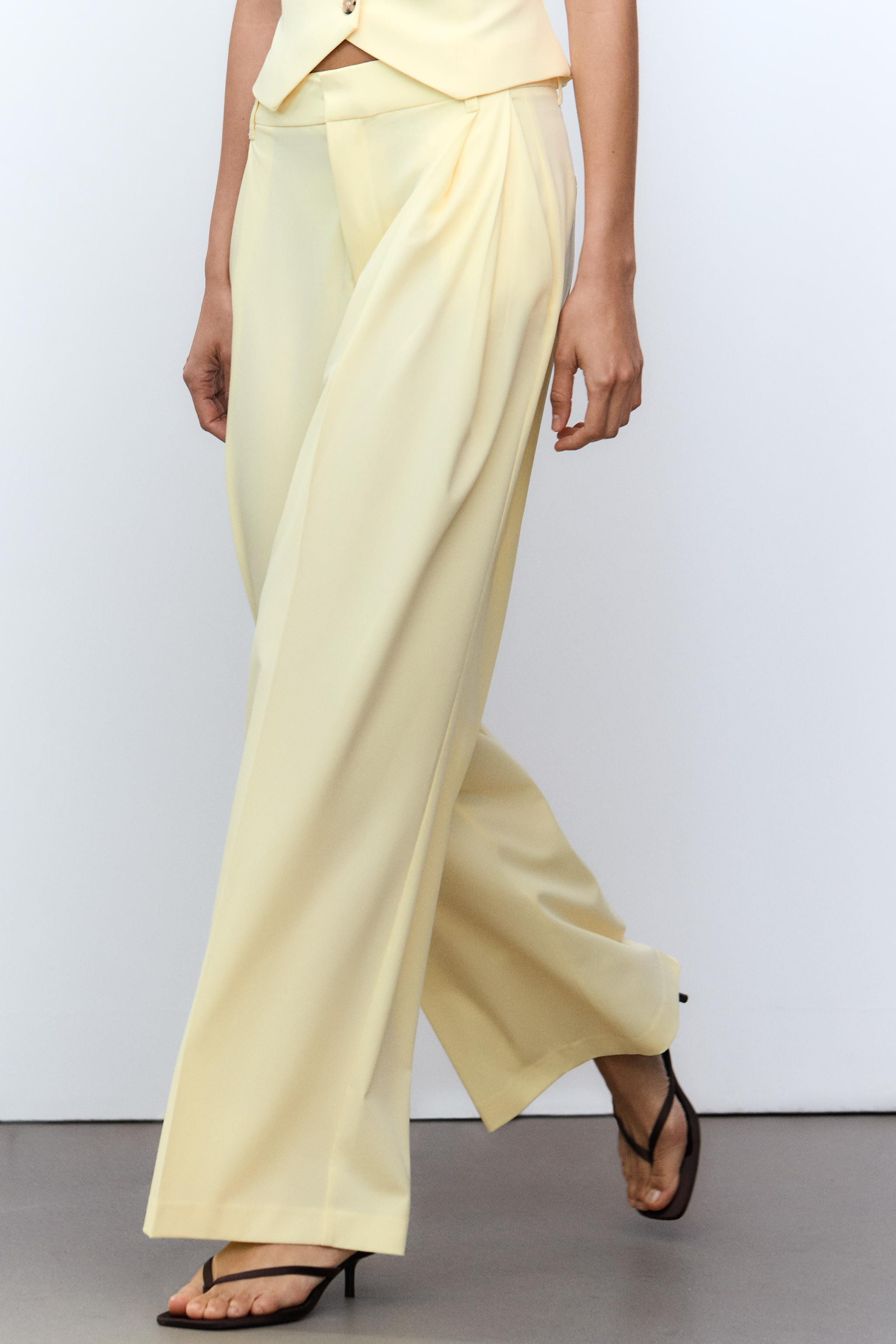 High-waisted pants with belt loops. Double pleat detail. Side pockets and faux back welt pockets.... | Zara Canada