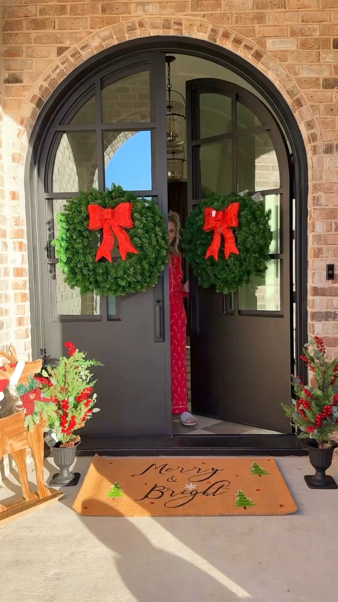 @wayfair #ad #wayfairpartner #wayfair

Transforming our front porch for the holidays 🎄✨ Everything here is from Wayfair, and I’m obsessed with how cohesive it looks together.

Bertrand Non-Slip Outdoor Door Mat (2’6” x 4’) — the cutest “Merry & Bright” mat that instantly makes your entryway festive. The quality is thick, durable, and perfect for layering over a neutral rug.
3-Foot Pre-Lit Christmas Wreath (Clear Lights, Red Velvet Bow) — I hung two of these on our exterior windows for symmetry. They’re battery-operated, give off a warm glow, and look incredible at night.
Bisou 76” Artificial Cypress & Pine Garland (Set of 2) — draped these across the doorway for that lush, full look without shedding needles. The texture and tone are super realistic!

🎁 Everything arrived fast and packaged perfectly. Linking all details on my LTK for easy shop + sizing!
