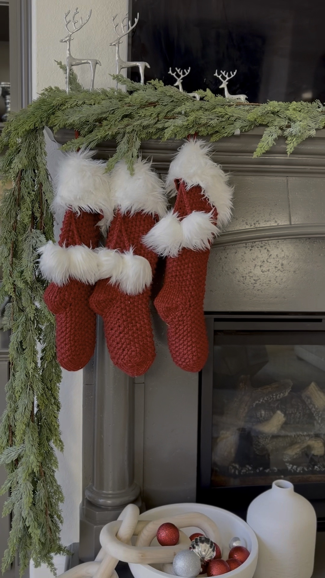 faux cedar garland @amazon (I used 5 strands here!) / linked similar reindeer stocking holders & similar stockings (ours are older Pottery Barn) 

#LTKHome #LTKSeasonal #LTKHoliday