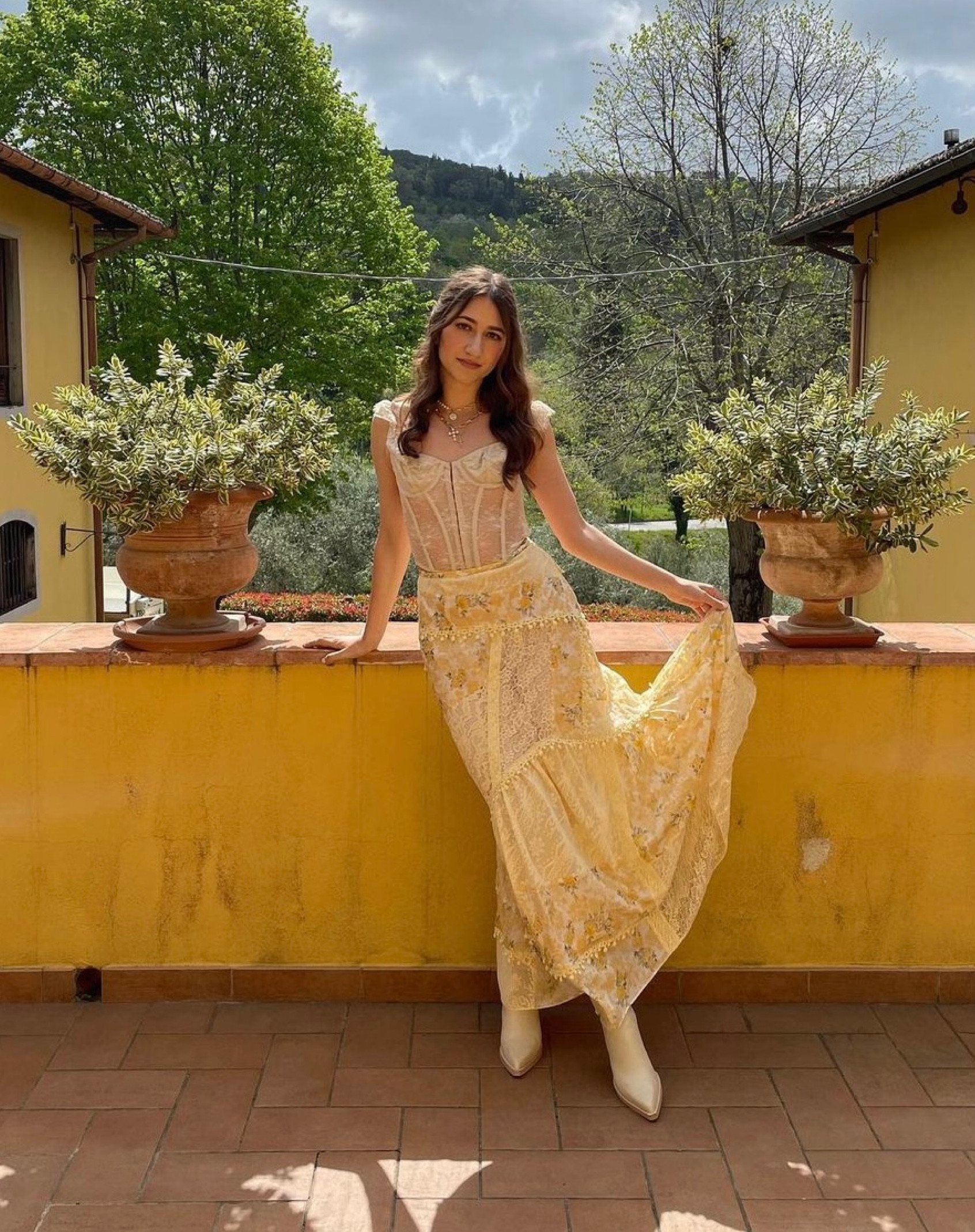 Under the Tuscan Sun☀️ Visiting a winery in Chianti, I styled my outfit in neutrals and yellow and it just so happened to match their home. This lace bustier is romantic and can be worn endlessly. The floral midi skirt is simply a piece of art 🌻 

#LTKtravel #LTKeurope #LTKstyletip