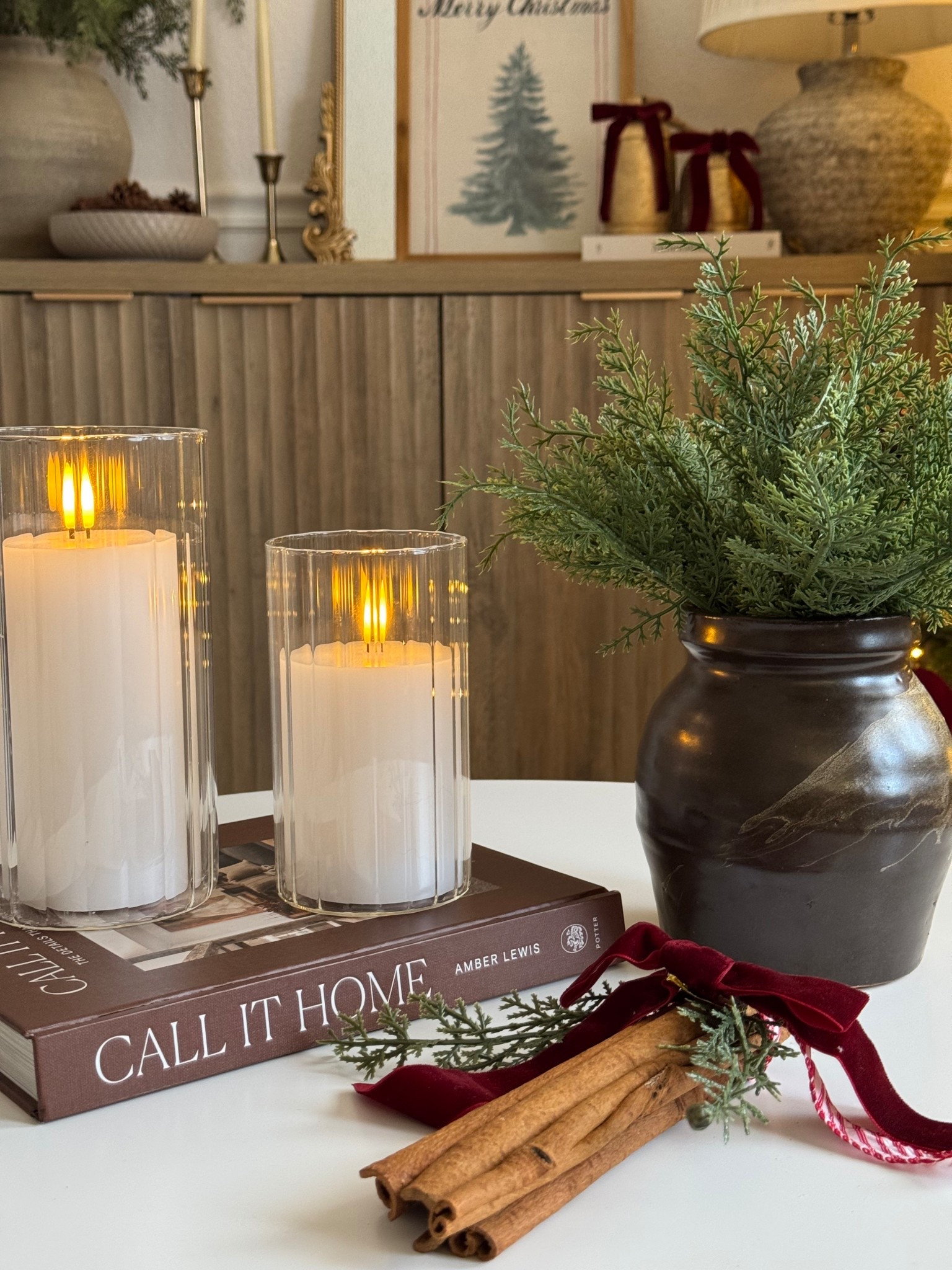 Christmas coffee table and ribbed glass vases with flameless candles 

#LTKHome #LTKSeasonal