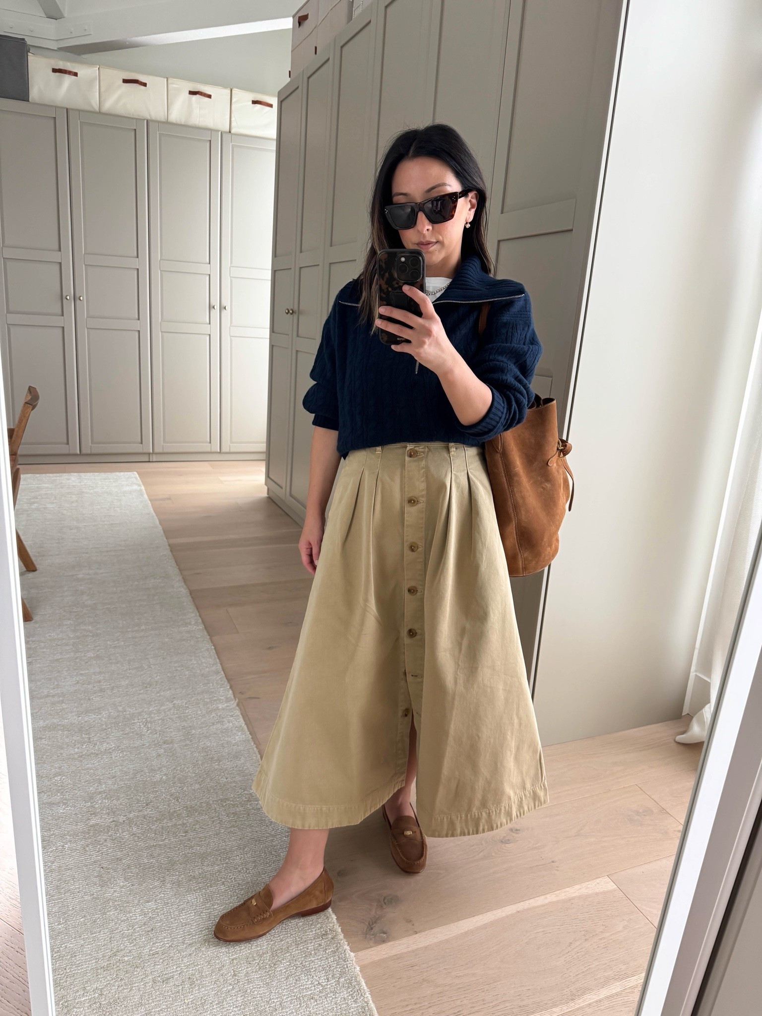 The perfect khaki midi skirt for fall. Runs small, size up. 

J.crew cashmere sweater small. Prefer the xs
Everlane tank xs
Faherty skirt 25. I need to size up
Veronica Beard loafers 5.5
Liffner bag in saddle
Celine sunglasses 
Dorsey James necklace 15”
Electric Picks earrings.

#LTKPetite #LTKOver40 #LTKmomlife