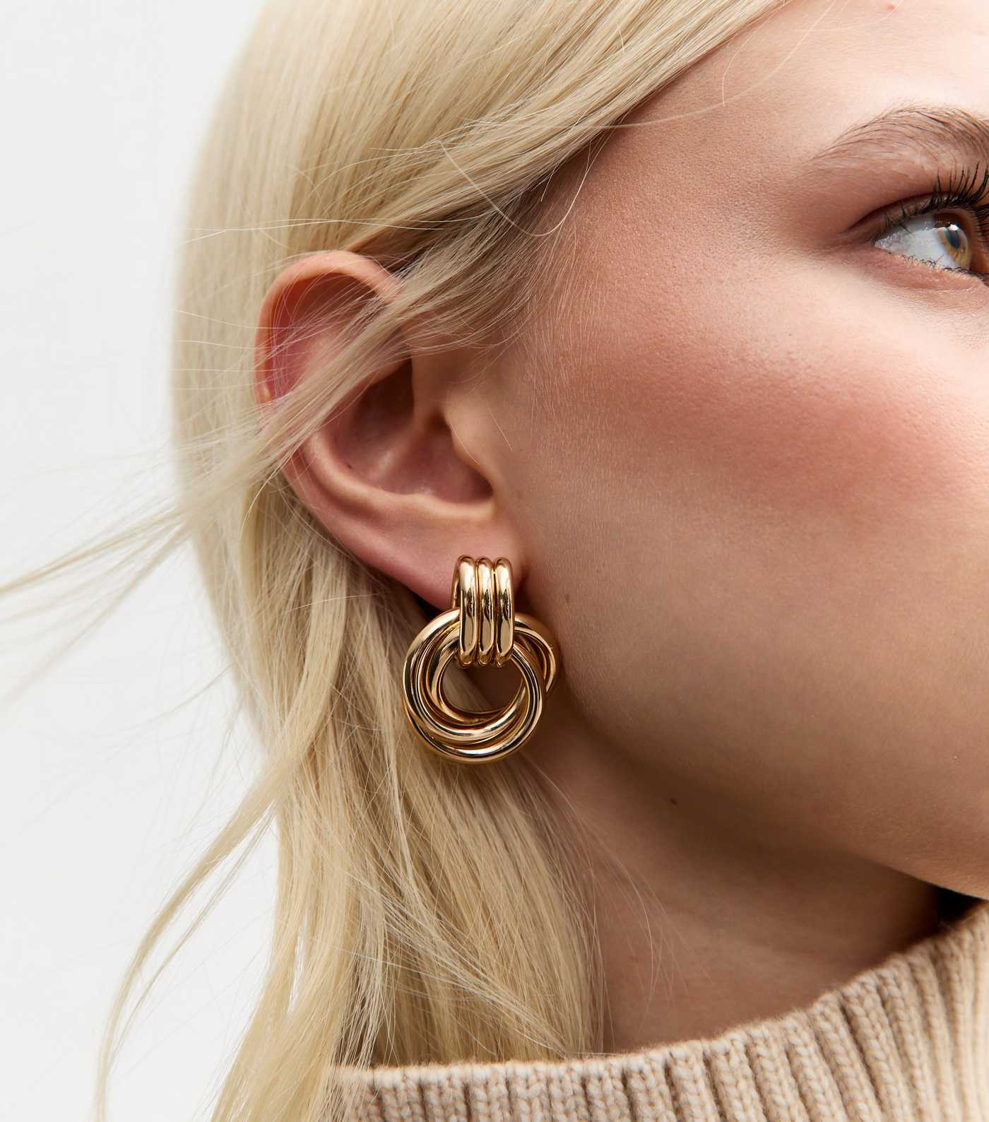 Gold Tone Interlinked Hoop Doorknocker Earrings
						
						Add to Saved Items
						Remove from... | New Look (UK)