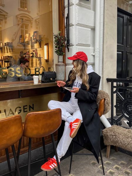 Weekend uniform 🫶🏻☕️

I’ve been living in this Adanola oversized  hoodie and Adanola sweatpants. I’m still loving pops of red and love this Adanola tracksuit accessorised with a red cap and red adidas gazelle trainers. 

Adding an oversized wool coat will instantly elevate your tracksuit making you feel more put together. The perfect everyday casual outfit in my opinion. This would also make the perfect airport travel outfit. 

#LTKeurope #LTKstyletip #LTKfindsunder100