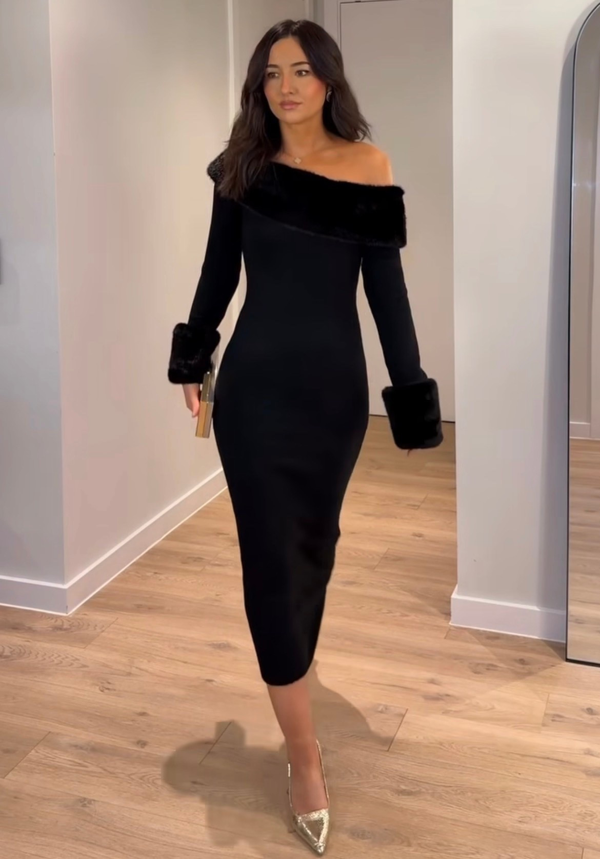 Black  fur off the shoulder dress 

Gold pumps 
 Gold clutch 

#LTKHoliday #LTKootd #LTKSeasonal