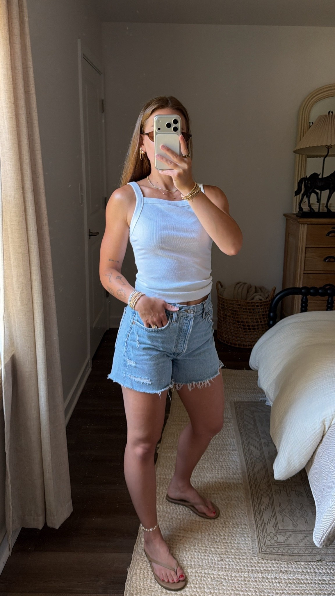 7/23/26 My Go-To Casual Summer Outfit ☀️

This has been one of my go-to summer outfit formulas lately. A classic white tank, denim shorts, simple sandals, and a few accessories that pull everything together. Easy, timeless, and something I’ll be reaching for over and over again this summer.

Everything is linked here ✨