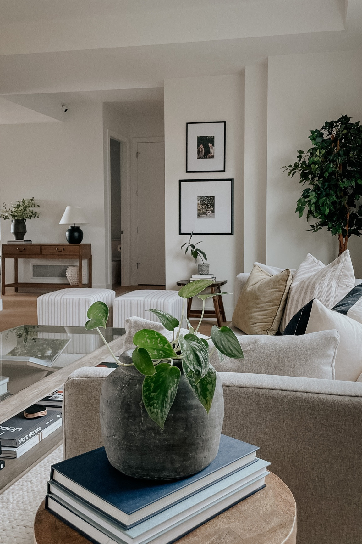 Living room inspiration. Antique vessel. Console table. Cube ottomans. Picture frames. Faux ficus tree. Target furniture. Target finds. Home decor. Amber Lewis. #competition #LTKFind  

#LTKstyletip #LTKFind #LTKhome