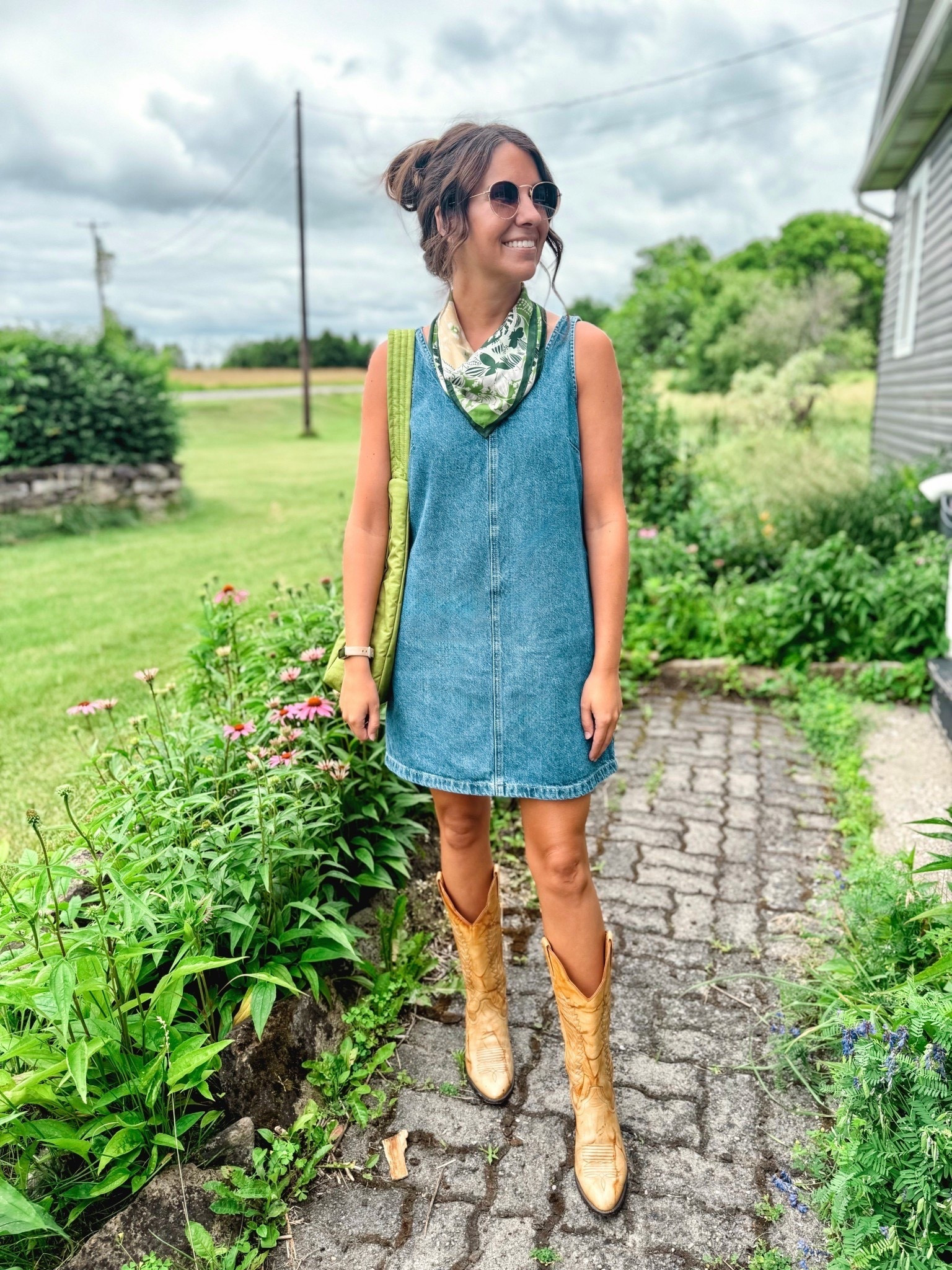 My dress is currently sold out, but if it comes back in stock, I am wearing size xs petite. I also linked similar denim dresses.

My cowboy boots are from eBay (a great place to look for cowboy boots!) and I also linked some similar ones. 
