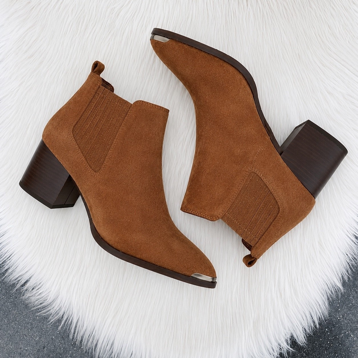 PAIGE Lyra Pointed Toe Chelsea Boot

These are the definition of elevated everyday style. 🤎 The pointed toe and rich suede give them a luxe designer feel, while the sculpted block heel makes them easy to wear from coffee runs to date night. They fit true to size, hug the ankle beautifully, and are surprisingly comfortable thanks to the stable heel. If you’re between sizes or plan to wear thicker socks in the fall, consider going up half a size.