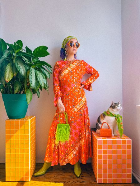 Fall transitional outfit 🍂🌸

Champagne wears a multicolored orange red and yellow gold maxi dress from Never Fully Dressed, green leather boots and neon like green feather rhinestone purse bag, gold shell necklace and jeweled earrings.

Dopamine dressing colorful vibrant eclectic maximalist maximalism rainbow multicolored colored hair style fashion inspo color fall Halloween witch costume 

#LTKSeasonal #LTKHoliday #LTKHalloween