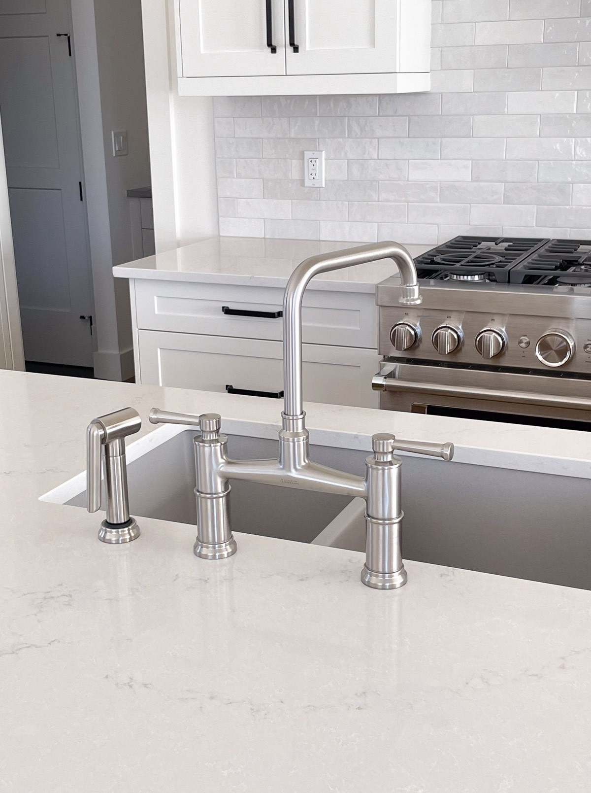 Really loving the look of the Brizo Artesso bridge faucet in the kitchen. The side sprayer makes cleanup effortless and the design feels so polished and timeless. Available in 6 different finishes. Currently on sale!

#LTKSaleAlert #LTKHome