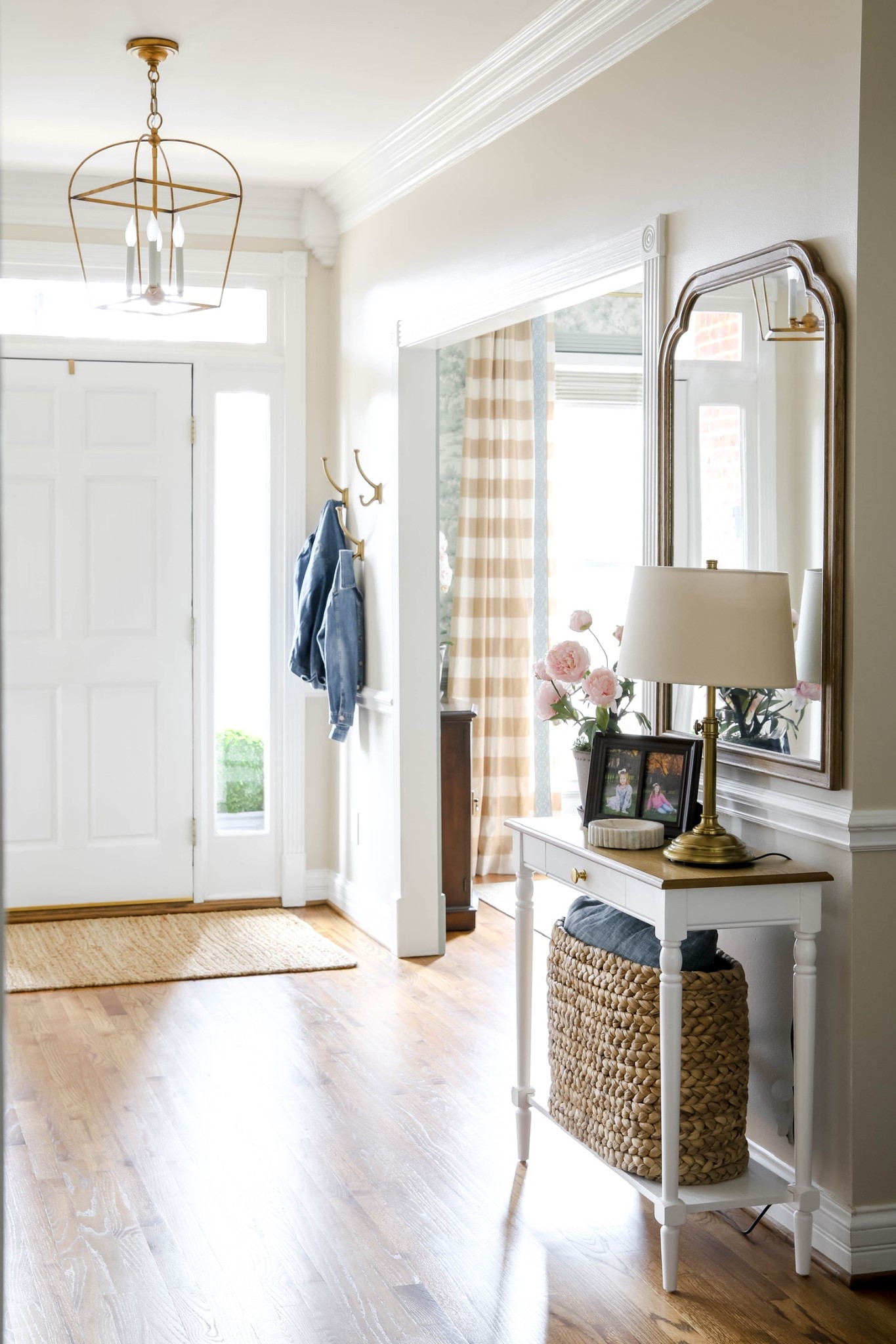 A side table, mirror, and hooks for coats are perfect in our entryway.

#LTKHome