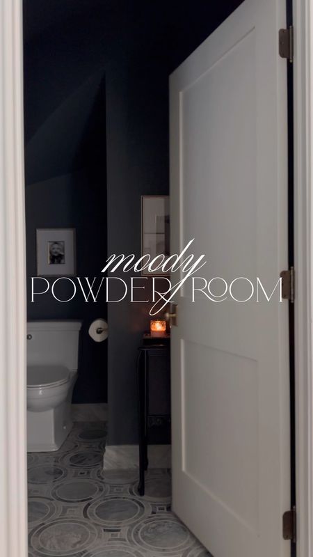 Moody powder room decor 🖤 Paint color is SW Web Gray. My black cabinet is vintage!

Amazon finds, arch mirror, brass bathroom, modern sconces, bathroom art, console sink, bathroom styling 

#LTKstyletip #LTKfindsunder50 #LTKhome