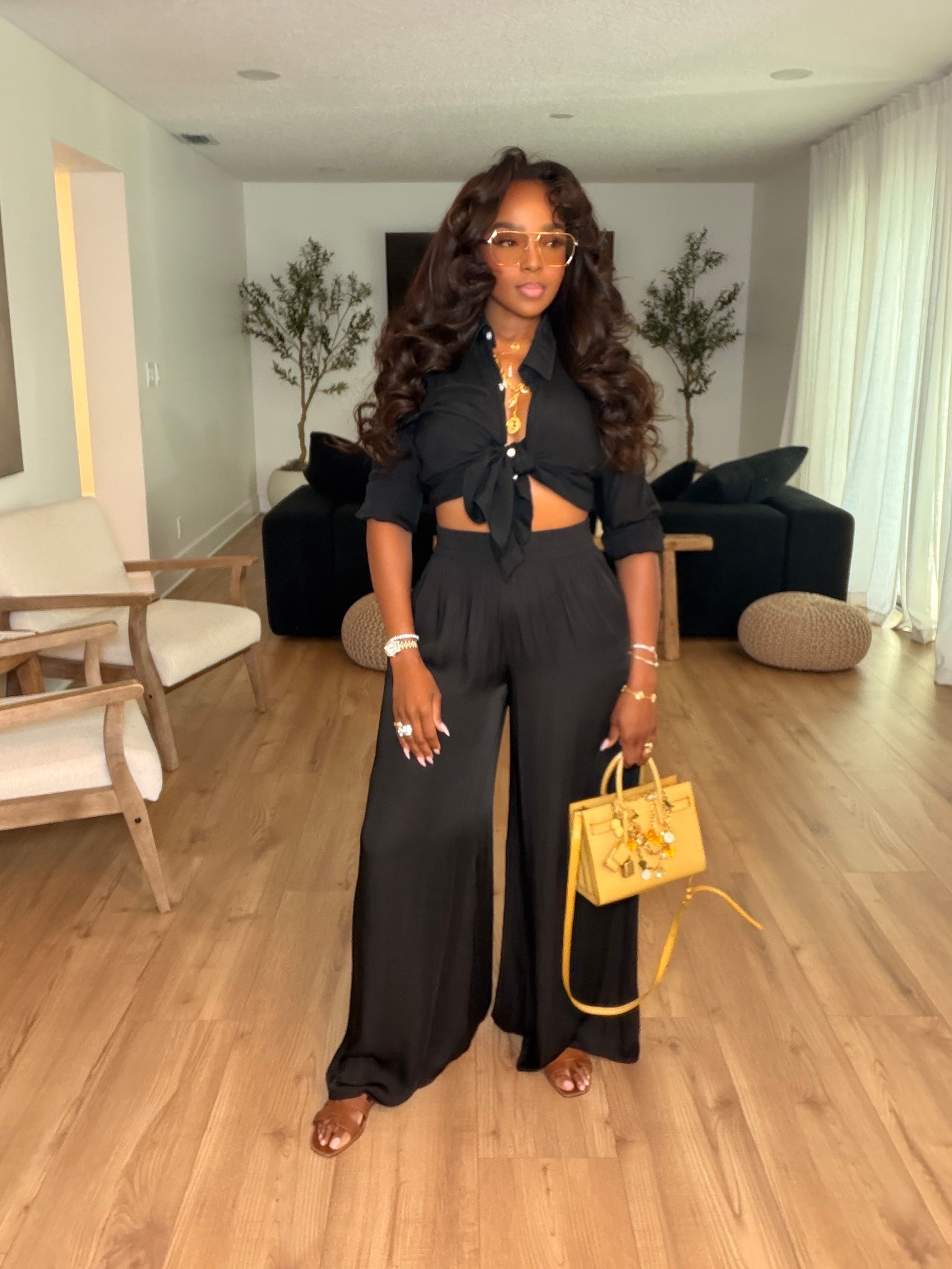 Scroll to shop this all-black elevated look 🖤  

This set is the perfect mix of effortless and put together—flowy wide leg pants paired with a tie front top that adds shape without sacrificing comfort. The monochrome moment makes it feel instantly chic, and you can style each piece so many different ways, making it a strong long-term wardrobe staple with a lower cost per wear.

Perfect for dinners, date nights, vacations, and nights out.

📏 Measurements: 5’4”, 140 lbs, 34D bust, 27” waist, 40” hips

Follow me on Instagram and YouTube @kirasfashionfinds