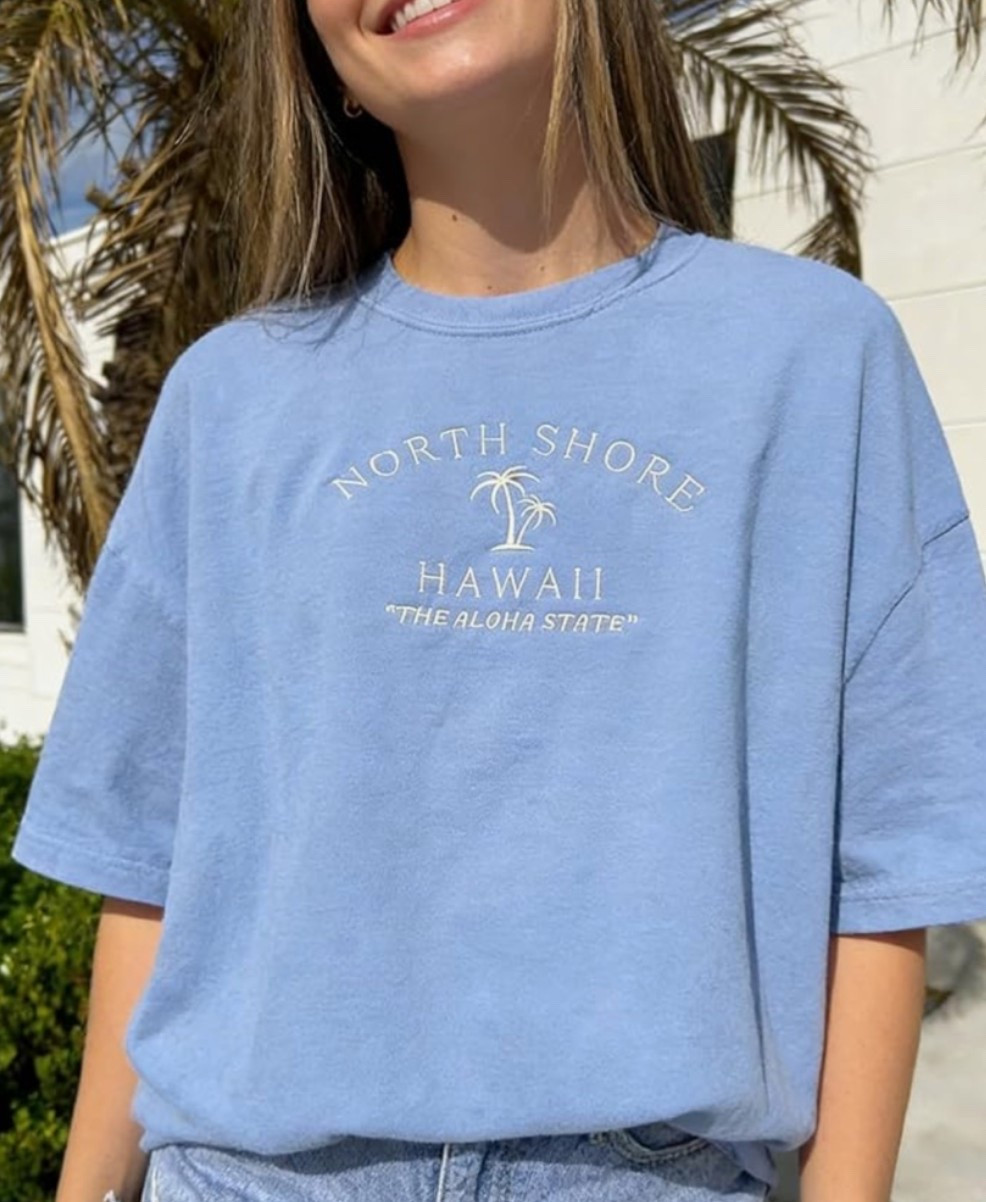Women’s oversized Hawaiian graphic t-shirt for easy summer beach vacation outfits. 🌺 This retro tropical floral tee is perfect for casual summer outfits, beach days, pool cover-ups, lake trips, travel days, resort wear, and laid-back vacation style. 

Shop this Amazon summer top if you want an easy oversized tee with tropical vacation energy. 🏝️

#LTKActive #LTKMidsize #LTKSeasonal