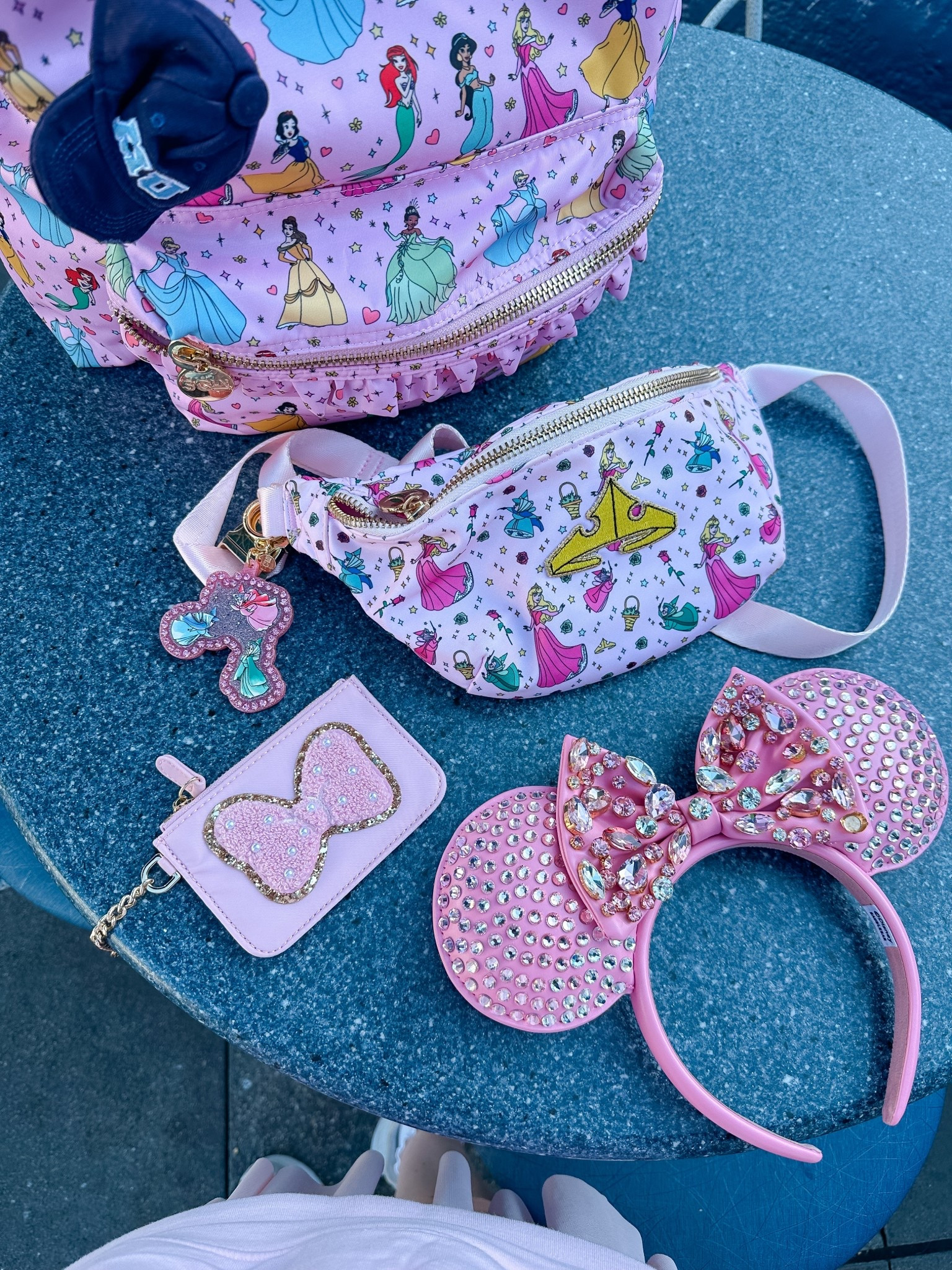 •Accessories fit for a princess 👑 My rhinestone ears are currently 25% off! + my Minnie Mouse bow patch is under $10. Perfect for your next Disney trip 🎀🩷• #stoneycloverlane #stoneycloverxdisney #disneyxbaublebar 