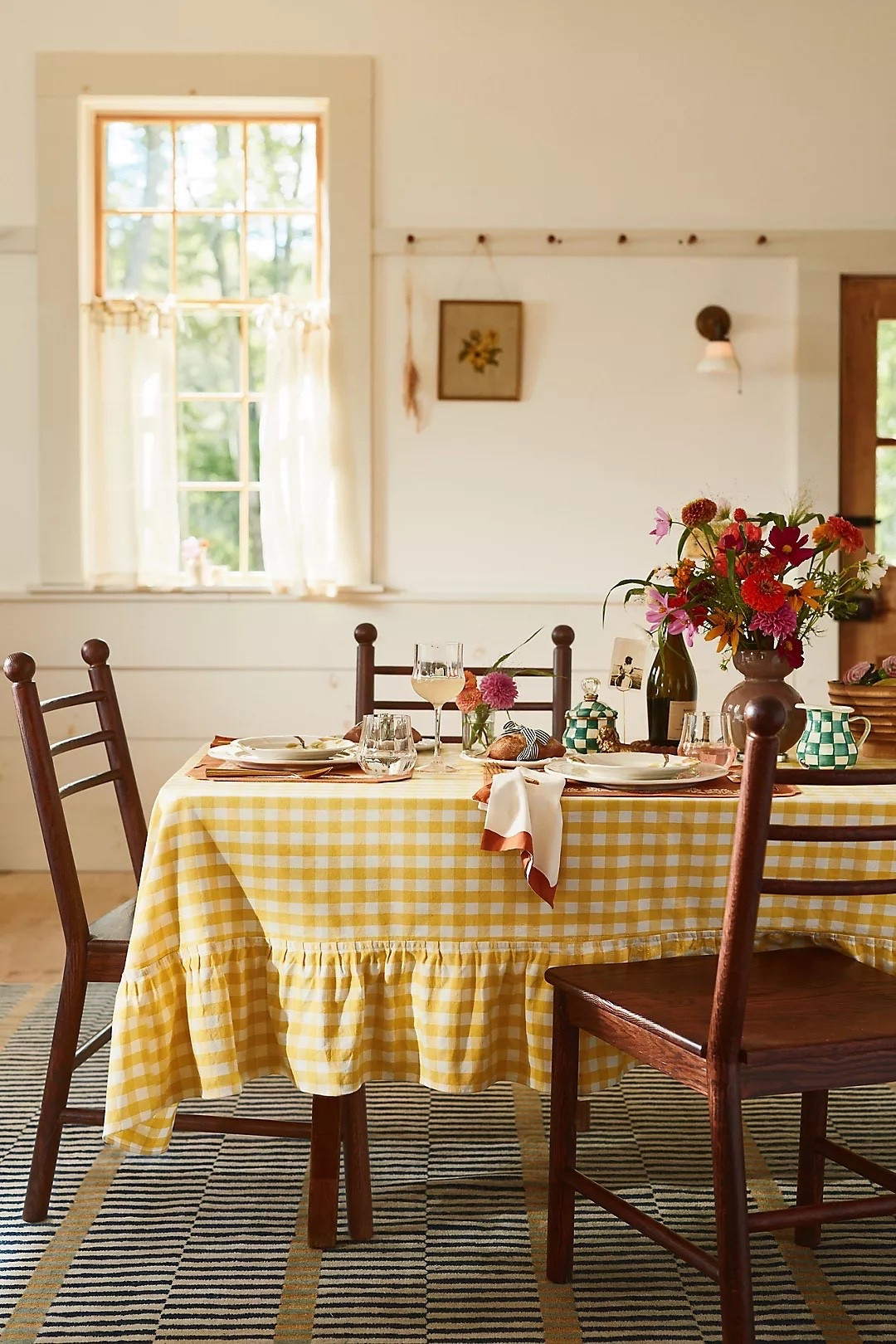 Thanksgiving table by Anthropologie — the yellow gingham checkered tablecloth with a ruffled skirt sets a joyful, charming mood for the holiday feast. 🍂✨

#ThanksgivingTable #AnthropologieHome #HolidayDining #TablescapeInspo #GinghamStyle #FallDecor #HostingSeason #CozyChic #TableSettingIdeas #SeasonalStyle

#LTKHome #LTKHoliday #LTKGiftGuide