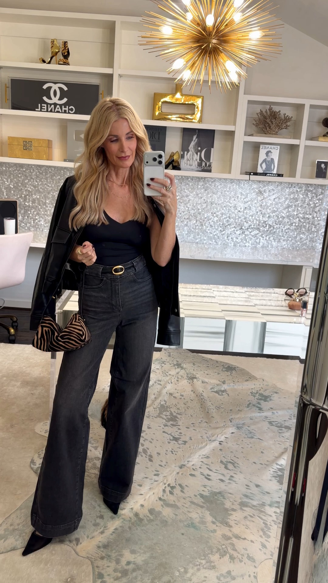 Want that “legs for days” look? These NYDJ high-waisted wide-leg jeans have a flattering long silhouette, a faded black wash, and are so comfortable. I paired them with a black bodysuit and a faux-leather bomber for an edgy night-out look. I’m wearing a size 00 in the jeans. #NYDJ #WideLegJeans #BlackDenim #DateNightOutfit #WomenOver40Style #LTKOver40 

 #LTKootd #LTKSeasonal #LTKOver40