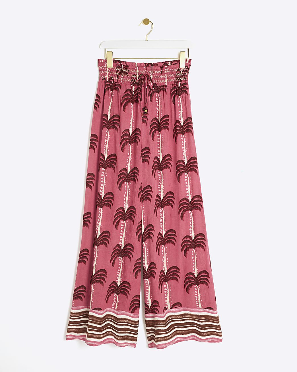 Pink palm tree wide leg beach trousers | River Island (UK & IE)