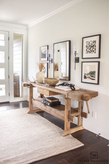 Rustic modern entry way, mixing vintage pieces with modern art. 

#LTKhome #LTKstyletip