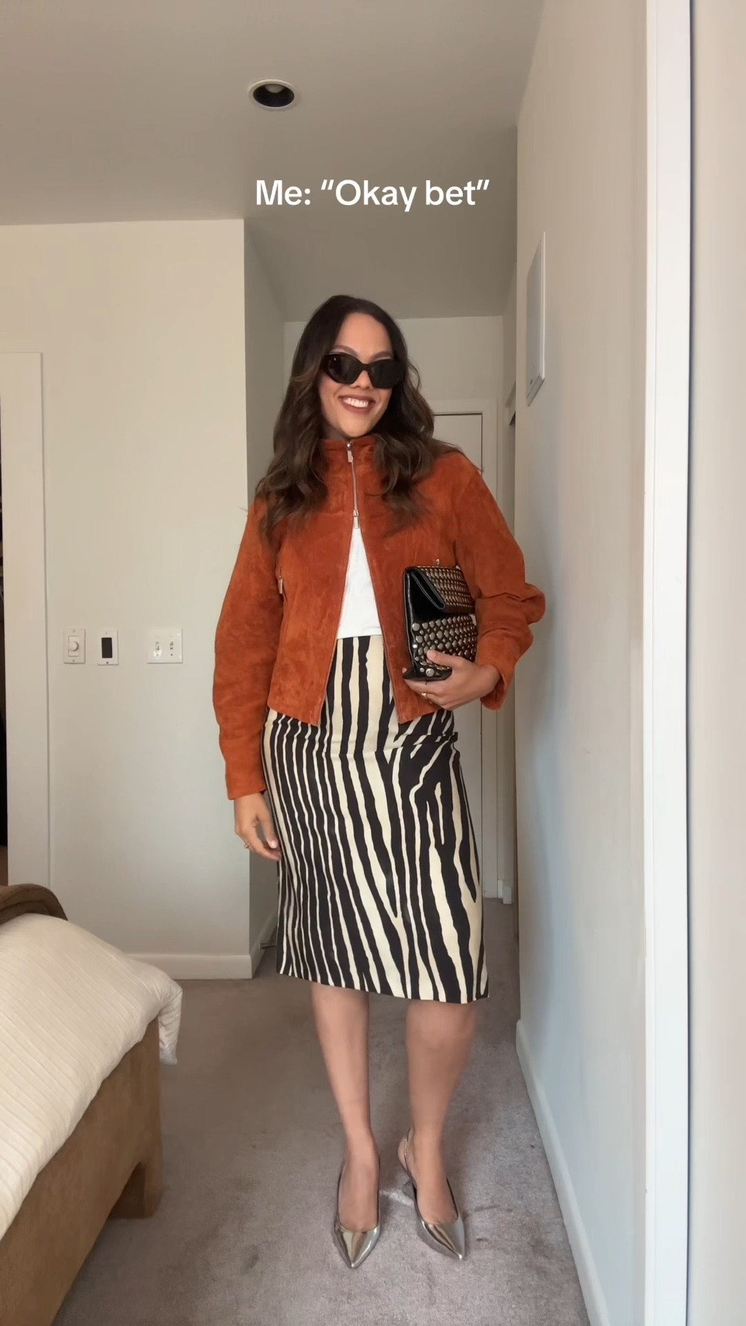 Zebra skirt styling ideas!

Skirt:
-Massimo Dutti zebra print midi skirt, I have a size 40. Similar options also linked. 

Outfit 1:
-Zara orange suede jacket, I have a size large.
-Anthropologie studded silver clutch.
-Silver slingback kitten heels, similar linked.
-Celine Triomphe cat eye sunglasses. 

Outfit 2:
-Reformation green sweater, I have a large. 
-Zara beige suede knee-high boots, similar linked. 
-Coach suede tote bag, similar colour linked. 
-Reformation 3/4 length sleeve white T-shirt, I have a large. 

Outfit 3:
-Reformation chartreuse gold satin jacket, I have a size large. 
-Anthropologie tassel necklace. 
-Banana Republic black tank top, I have a medium. 
-Ganni black buckled heels.

Outfit 4:
-Aritzia burgundy short-sleeved cardigan, I have a large. 
-Quince black and silver studded belt. 
-Poppy Barley black leather knee-high pointed boots. 
-Demellier London burgundy suede bag. 

Outfit 5:
-Reformation 3/4 Tshirt. 
-Uniqlo red sweater, I have a medium. 
-Madewell olive green woven bag. 
-Gap heeled black flip-flops. 

Outfit 6:
-Smythe fringed beige knit sweater. From last year, similar linked. 
-Coach green bag, similar linked. 

Outfit 7:
-Aritzia funnel-neck jacket, I have a medium. Similar colour linked (oculus jacket). 
-Demellier London black crocodile print bag. 

Outfit 8:
-Uniqlo red zip-up sweater, I have a medium. 
-Coach black tabby bag. 
-Gold slingback kitten heels, similar linked.

#LTKfall #LTKstyletip #LTKcanada