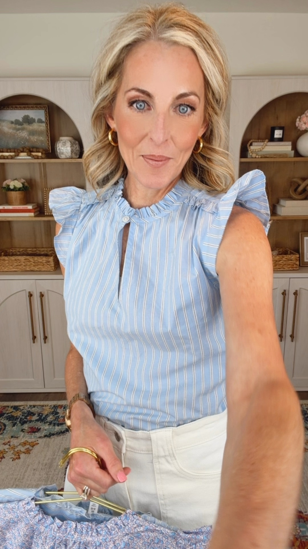 Turn up the sunny day charm with this $15 flutter sleeve top comes in six different colors. It’s breathable cotton and offers the elegance. You want pair it with your favorite denim… This pair is under $30 wearing a size is zero 