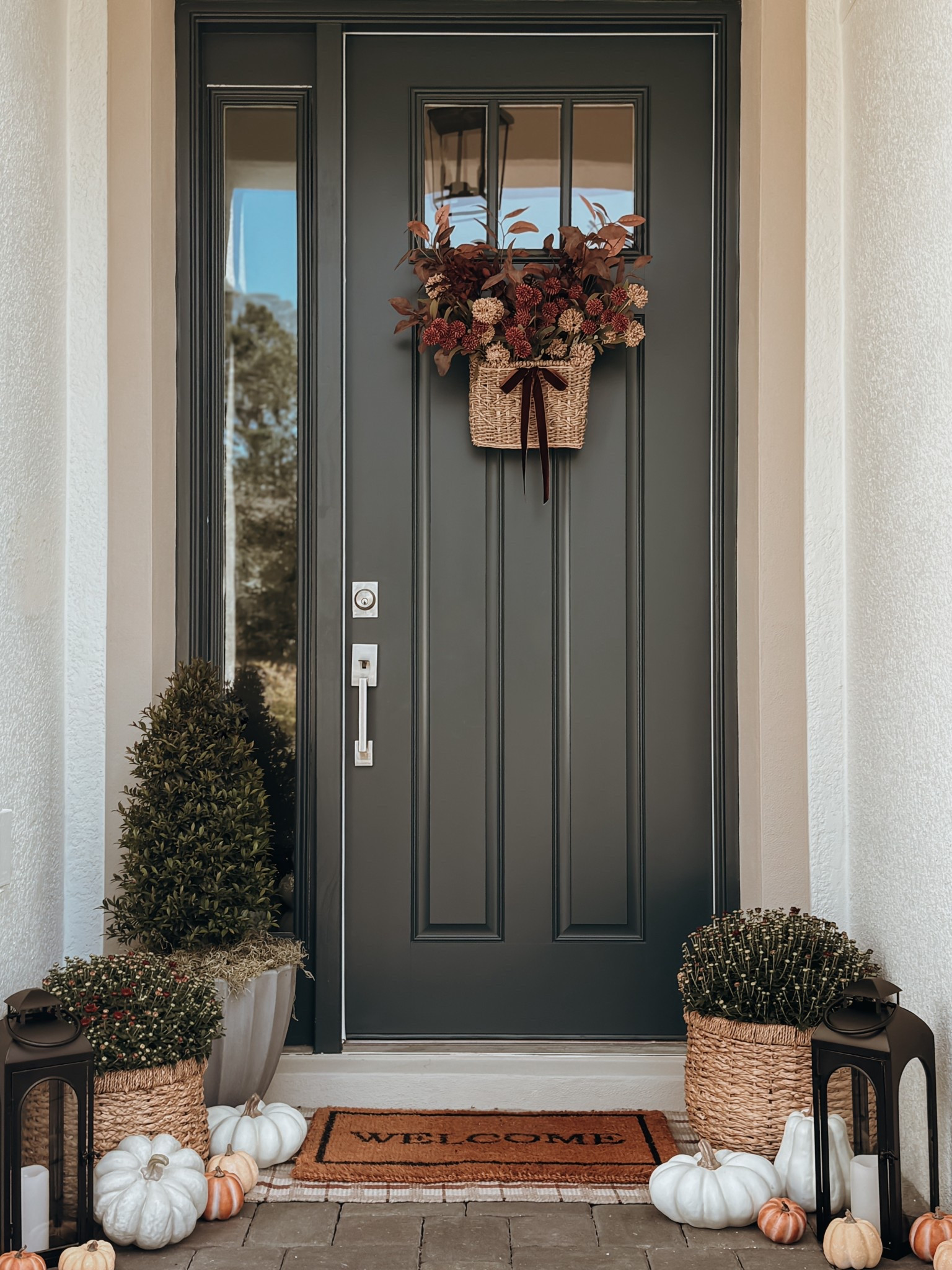 Where the season greets us first: a porch dressed in fall’s warmest embrace. I thought I’d try faux plants again this year, but one trip to Home Depot with my mom later… here we are with real mums. 🤭🌼 Comment welcome and I’ll send you the links to shop the rest!

#falldecor #fallporch #fallfrontporch #mums #autumn #autumndecor #autumnporch #fallfrontdoor #homedecor #homedecorideas 

#LTKHome #LTKSeasonal
