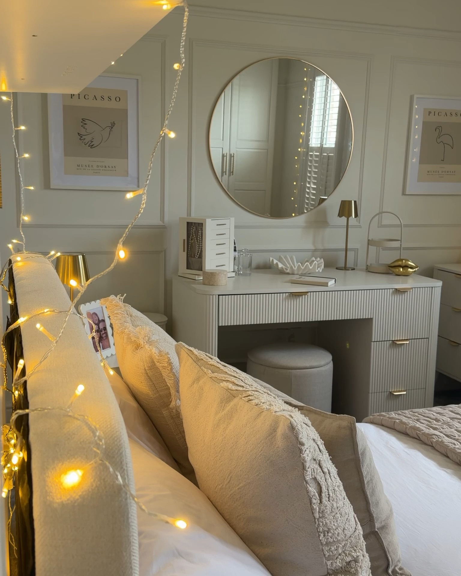 Rosie’s room is done! The dreamiest room for my little girl that’ll
grow with her. She knew exactly what she was wanted - something calm, peaceful and boho!  and our Layla White Feather Interiors delivered. Rosie room exceeds all my expectations and we are beyond happy with it!!! 

Paint - linen wash from Little Greene
Bed Bonnie Ottoman - habitat 
Pillows - H&M & John Lewis 
Bed throw - John Lewis 
Dressing Table/Desk, chest of drawers, bed side cabinet and stool - Dusk
Mirror - dunelm 
Carpet - City Flooring 
Lamps- John Lewis 
Jewellery box - Amazon 
Rug- dunelm 
Picasso pictures- Etsy 
Light shade - Graham and Green 
Handles - plank 
Bedding - M&S 
Fairy lights - lights 4 fun