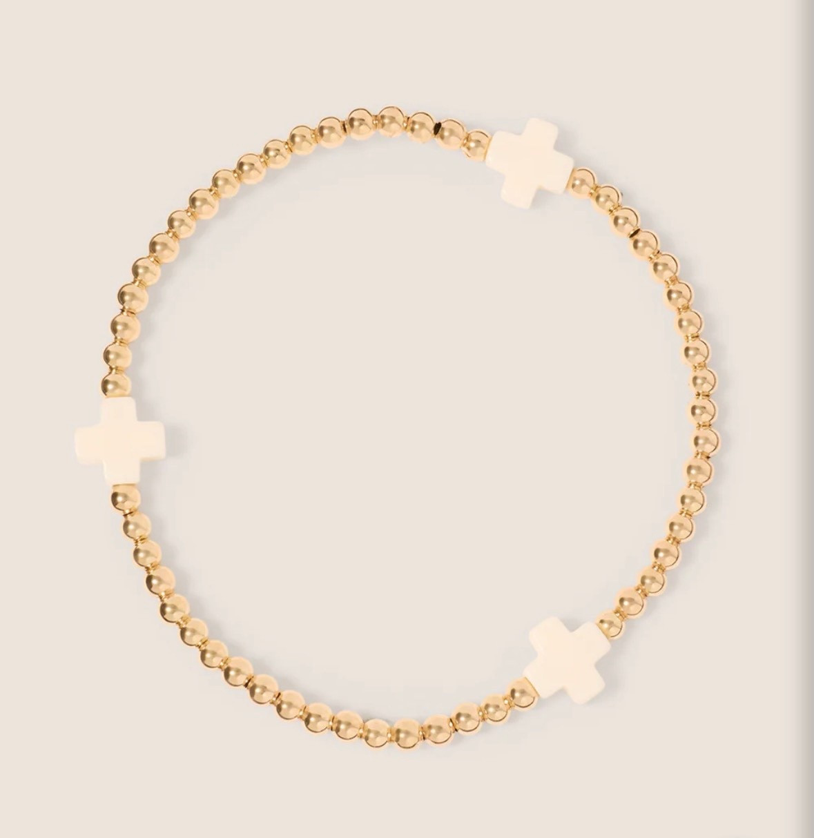 Signature cross 3mm bead bracelet in gold and white. Jewelry to wear every day. Easy to wear with no clasps to fuss with! 
kimbentley, enewton bracelet, 

#LTKGiftGuide #LTKFindsUnder50 #LTKTravel
