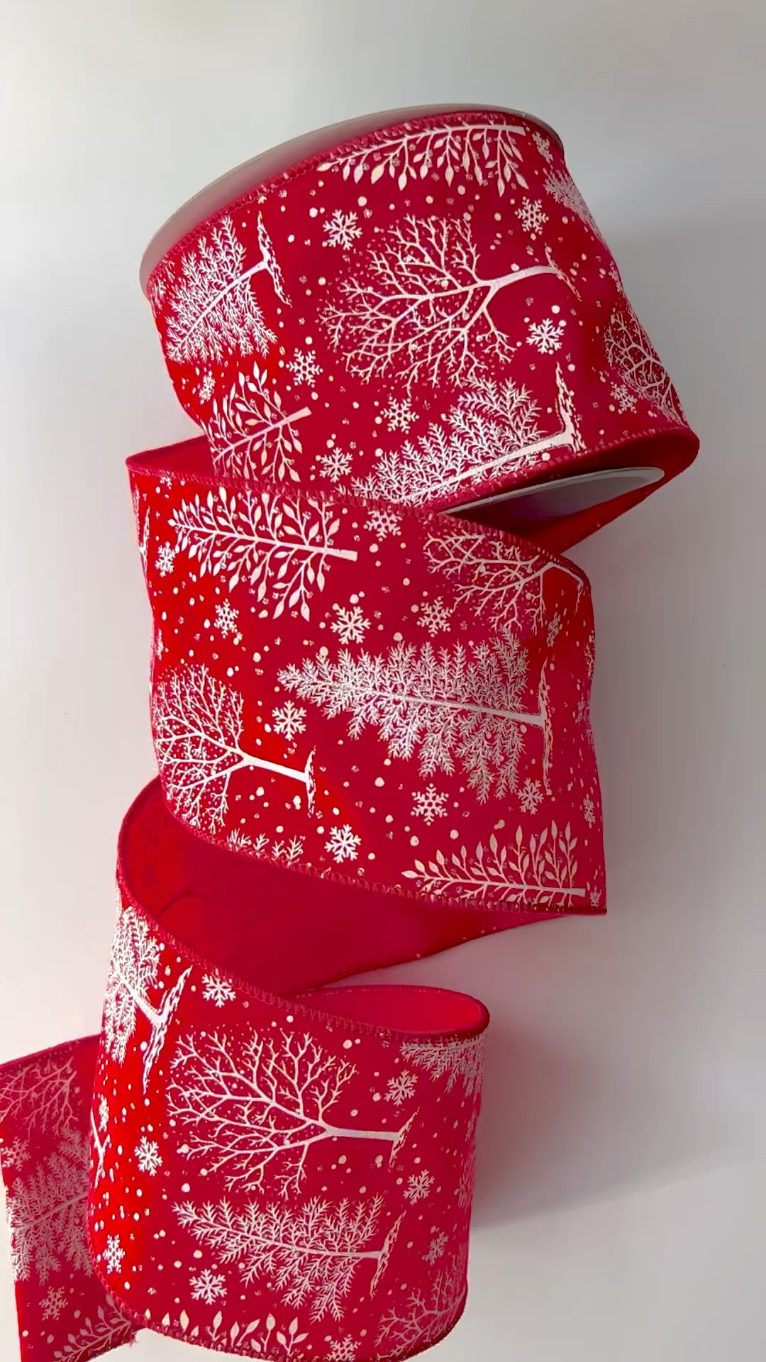 One of my favorite ribbon this Christmas season.  Red with white Christmas trees in four inch, wired, with a touch of glitter.  It was perfect with my red velvet ribbon and silver mirror ribbon to make bows for my Reindeer Forest tree.

#LTKhome #LTKHoliday #LTKSeasonal