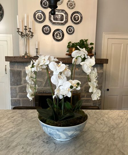 Faux orchid
Hand painted bowl
Orchid arrangement 

#LTKSeasonal #LTKhome