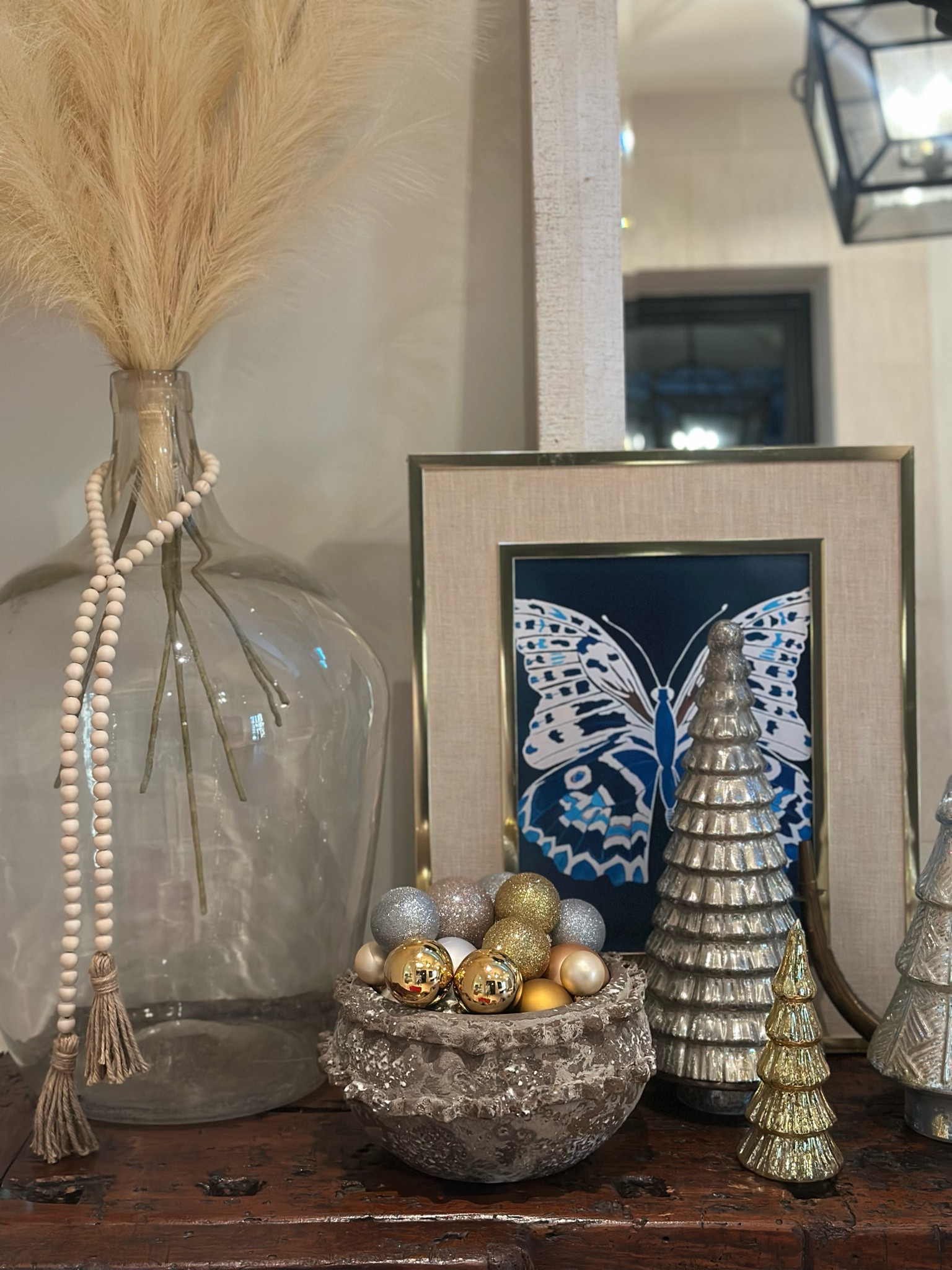 I love little vignettes like this one in our entryway! I found this vintage frame at an antique store and paired it with my butterfly art 🦋

#LTKHome #LTKGiftGuide #LTKFindsUnder50