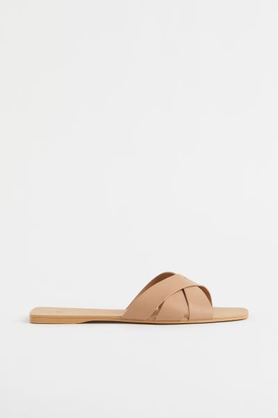 New ArrivalSlides in faux leather with wide, crossover foot straps and square toes. Faux leather ... | H&M (US + CA)