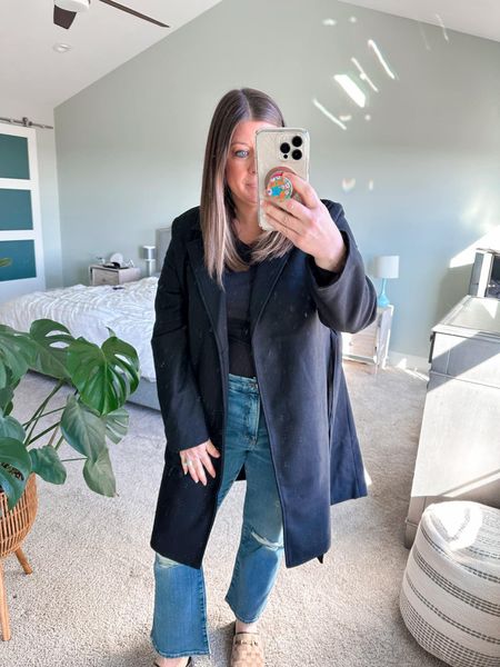 I’m all about incorporating more outerwear into my wardrobe right now! This classic black coat has a tie waist and is under $25. Such a score!

#LTKfindsunder50 #LTKsalealert #LTKover40