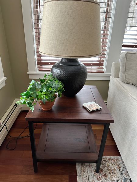 Classic black lamp on wood and metal end table.  Timeless style for the living room.

#LTKhome #LTKstyletip #LTKsalealert