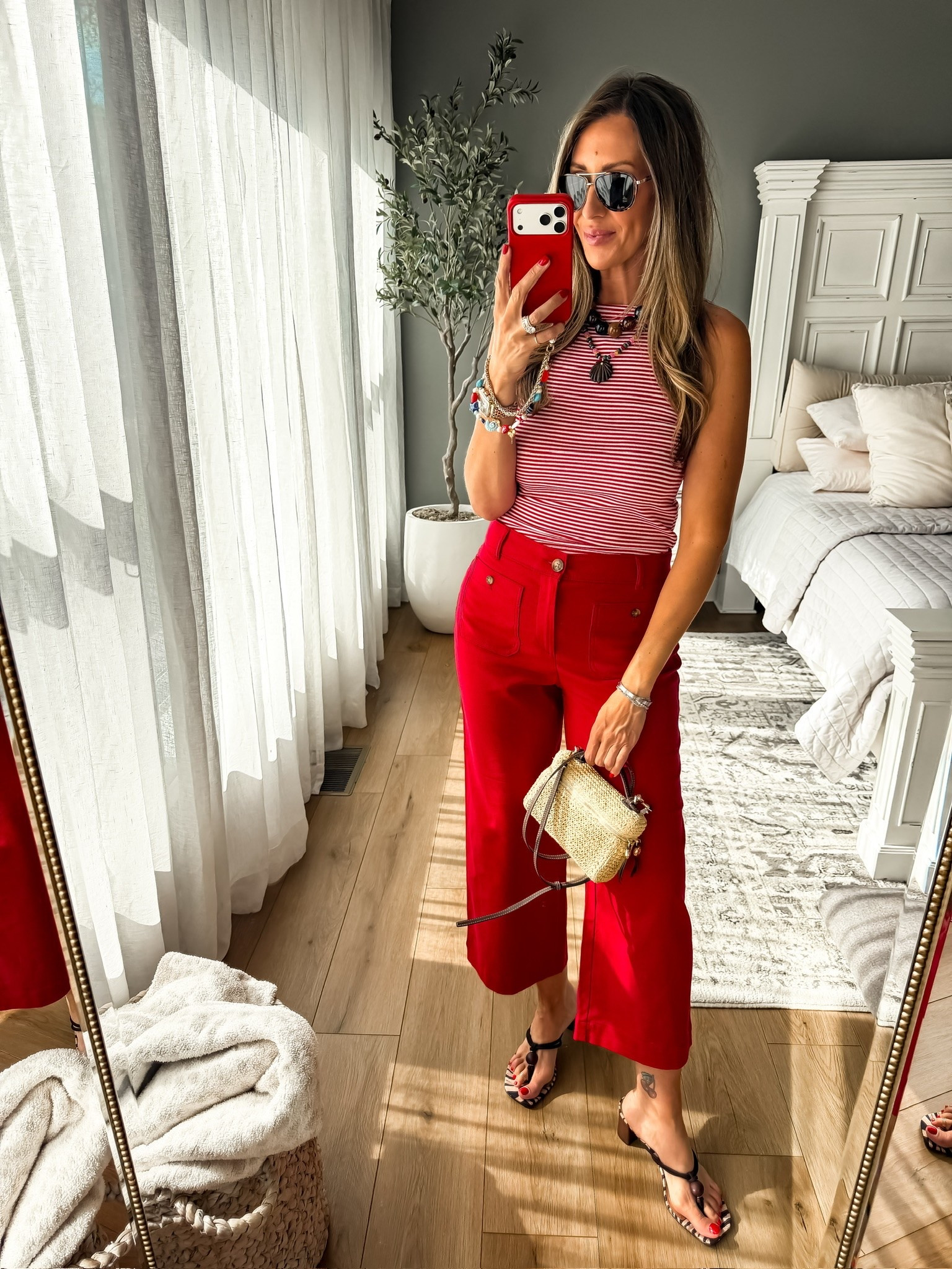 This red and white striped tank paired with bold red pants is such a fun statement look for summer. The colorful necklace and woven bag add the perfect finishing touch, making this outfit feel playful, polished, and ready for everything from vacation dinners to holiday weekends.

red pants outfit, striped tank, summer fashion, patriotic style, colorful accessories, statement necklace, woven bag, vacation outfit, summer outfit idea, Fourth of July style, resort wear, casual chic, themominstyle

#LTKootd #LTKSeasonal #LTKOver40