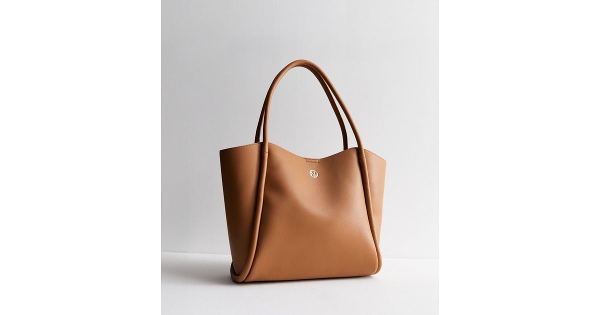 Tan Leather-Look Rolled Seam Tote Bag
						
						Add to Saved Items
						Remove from Saved Ite... | New Look (UK)