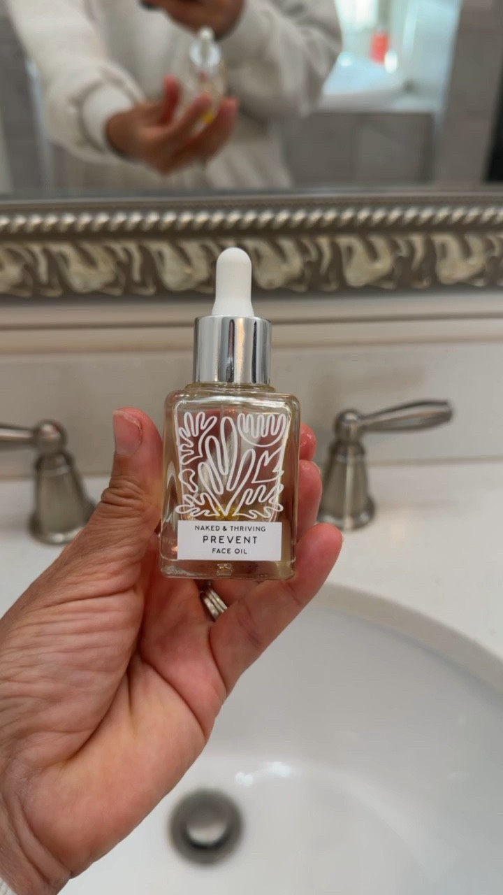 The glow-up I didn’t see coming. 
I used to run from face oils (hello teenage skincare fears 🙃), but this Naked & Thrivinb face oil completely changed my skin.

Just a few drops go such a long way. Hydrating, balancing, and giving that effortless, healthy glow without feeling heavy or greasy. It layers beautifully with my skincare routine and works for busy mornings when I need quick, effective results.

If you’ve been hesitant about adding a face oil into your routine, this is your sign. The right one can help support your skin barrier, lock in moisture, and bring your skin back into balance.

face oil, golden face oil, hydrating serum, glowing skin, dewy skin, anti-aging skincare, skincare over 40, mom skincare routine, clean beauty, lightweight face oil, skin barrier repair, dry skin solution, combination skin routine, everyday skincare essentials, simple skincare routine, radiant complexion, beauty must haves, skincare favorites, nourishing facial oil, healthy skin glow. 

#LTKgrwm #LTKmorningroutine #LTKBeauty