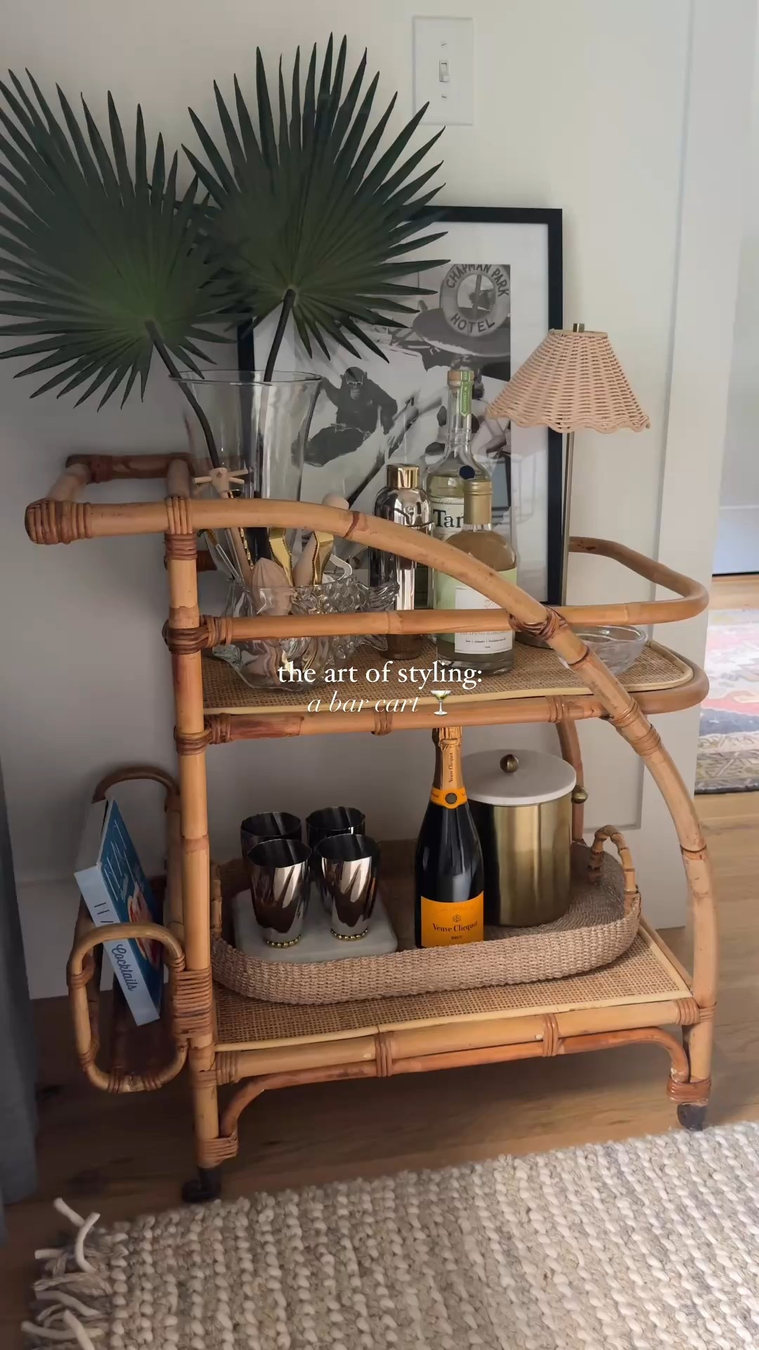 the art of styling: a barcart 🍸 | it feels collected, chic & coastal- just the way I like it! the @anthropologiehome silver julep cups + shaker were a chefs kiss find ✨ 

#artofstyle #barcart #barcartstyling #cocktailhour #happyhour #coastalhome #rattan #homegoods #anthrohome #homedecor 

#LTKHome #LTKParties #LTKFindsUnder50