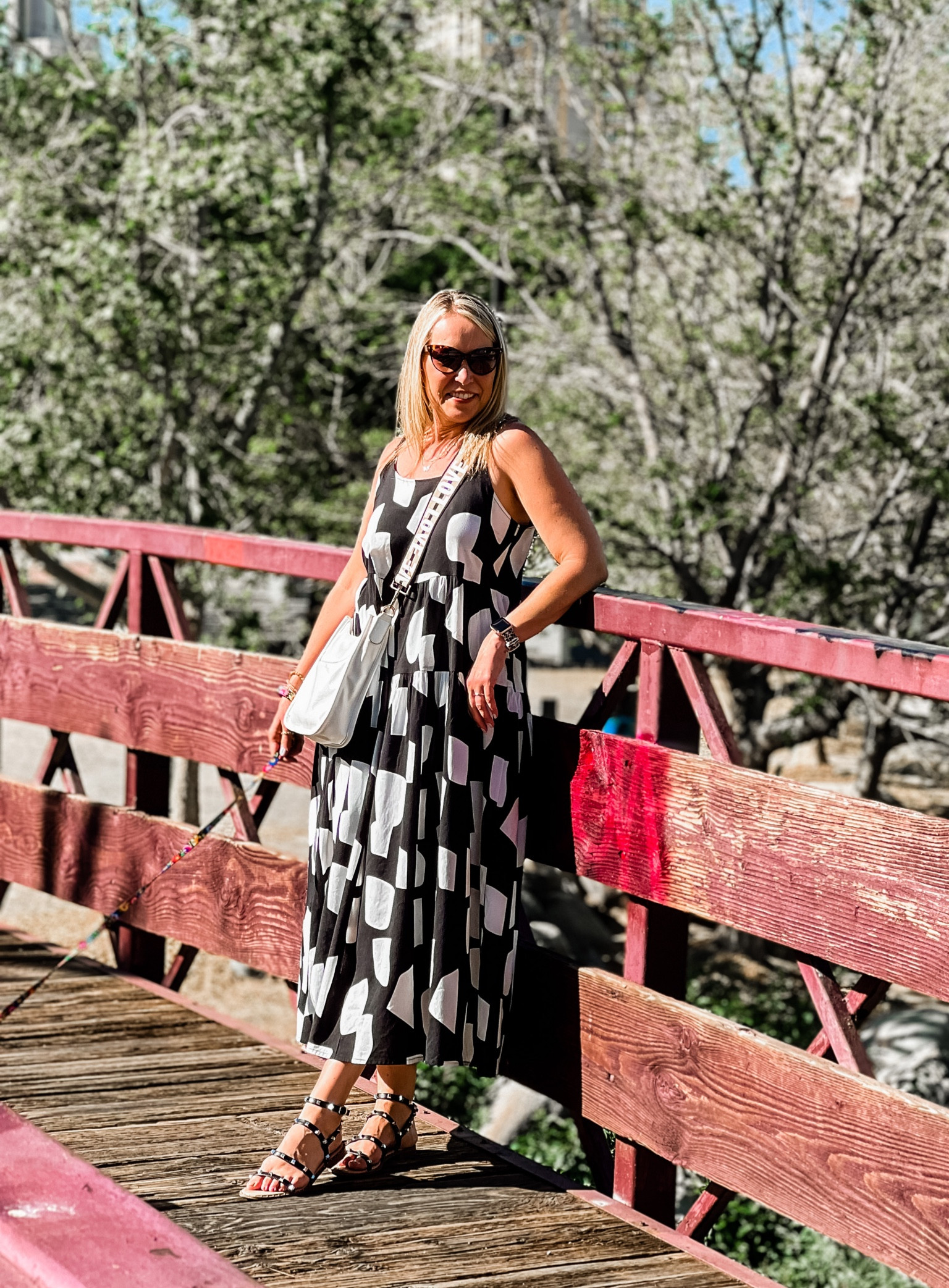 Tiered black and white maxi dress with adjustable straps. Eye catching geometric print  

#LTKSeasonal #LTKstyletip #LTKunder50
