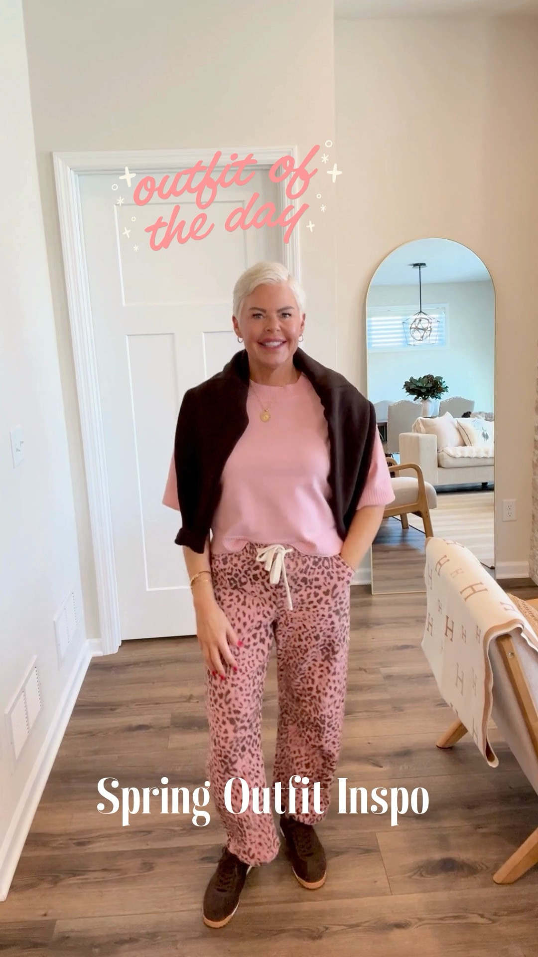 OOTD: Casual Spring Style Inspo. I love these pink & b brown leopard print pants from Amazon (size small) and I've paired it with an Anthro look for less cotton sweater with a brown cotton sweater from the Gap over my shoulders, brown sneakers and a designer inspired brown handbag. This outfit is perfect for running errands, lunch with friends and kids sports events. 

 #LTKootd #LTKmomlife #LTKOver40