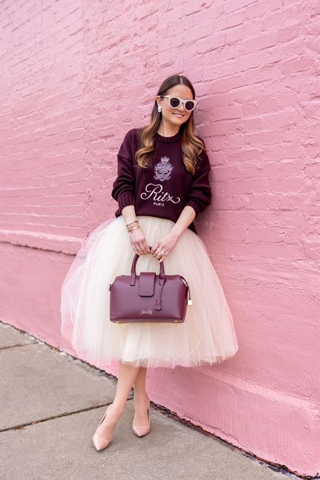 Absolutely love this cashmere sweater from the FRAME X Ritz Paris collection. I styled it with this tulle skirt but also plan to wear it with joggers and white denim. Lastly, don’t sleep on this burgundy handbag - one of my new faves! 

#LTKHoliday #LTKSeasonal #LTKitbag