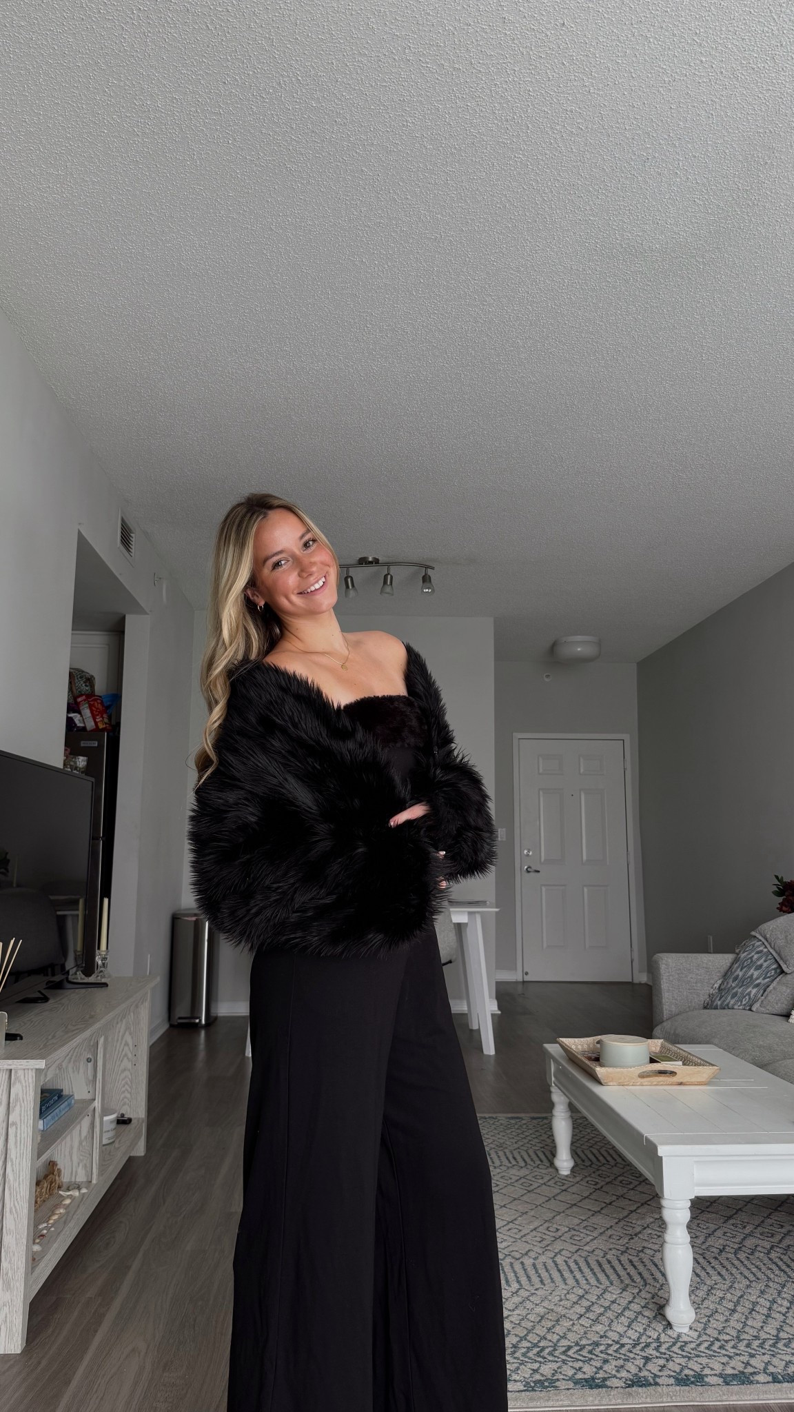 Black jumpsuit and fur jacket! 

#LTKootd